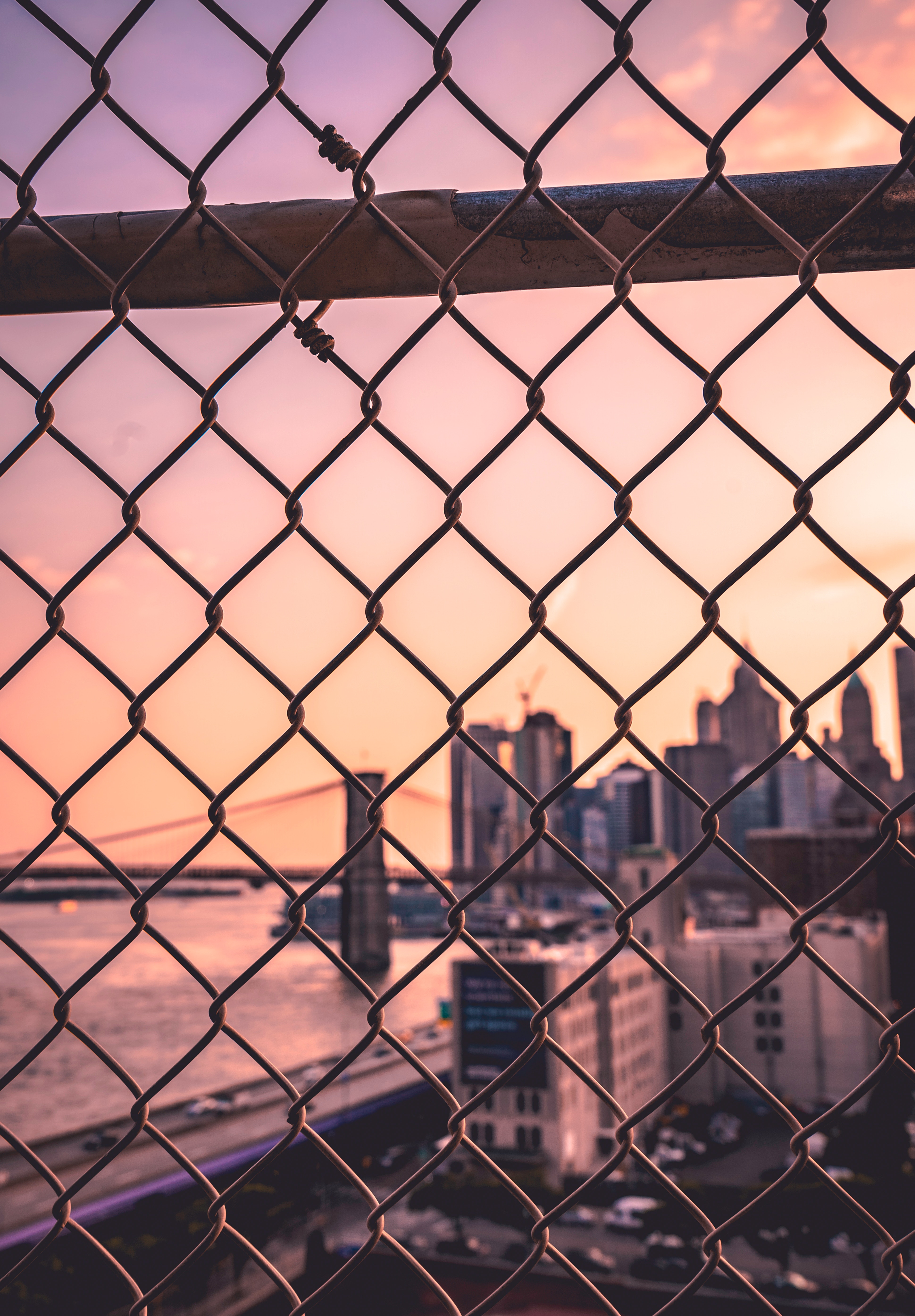 Download mobile wallpaper Fence, Cities, City, Smooth, Grid, Blur for free.