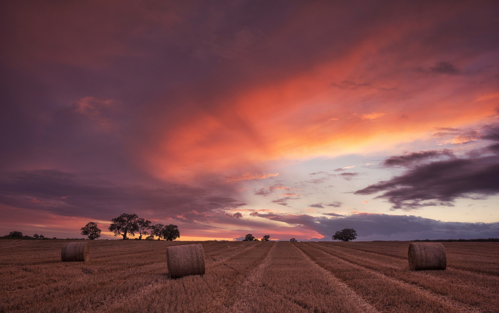 Free download wallpaper Nature, Sunset, Sky, Summer, Earth, Field, Cloud, Haystack on your PC desktop