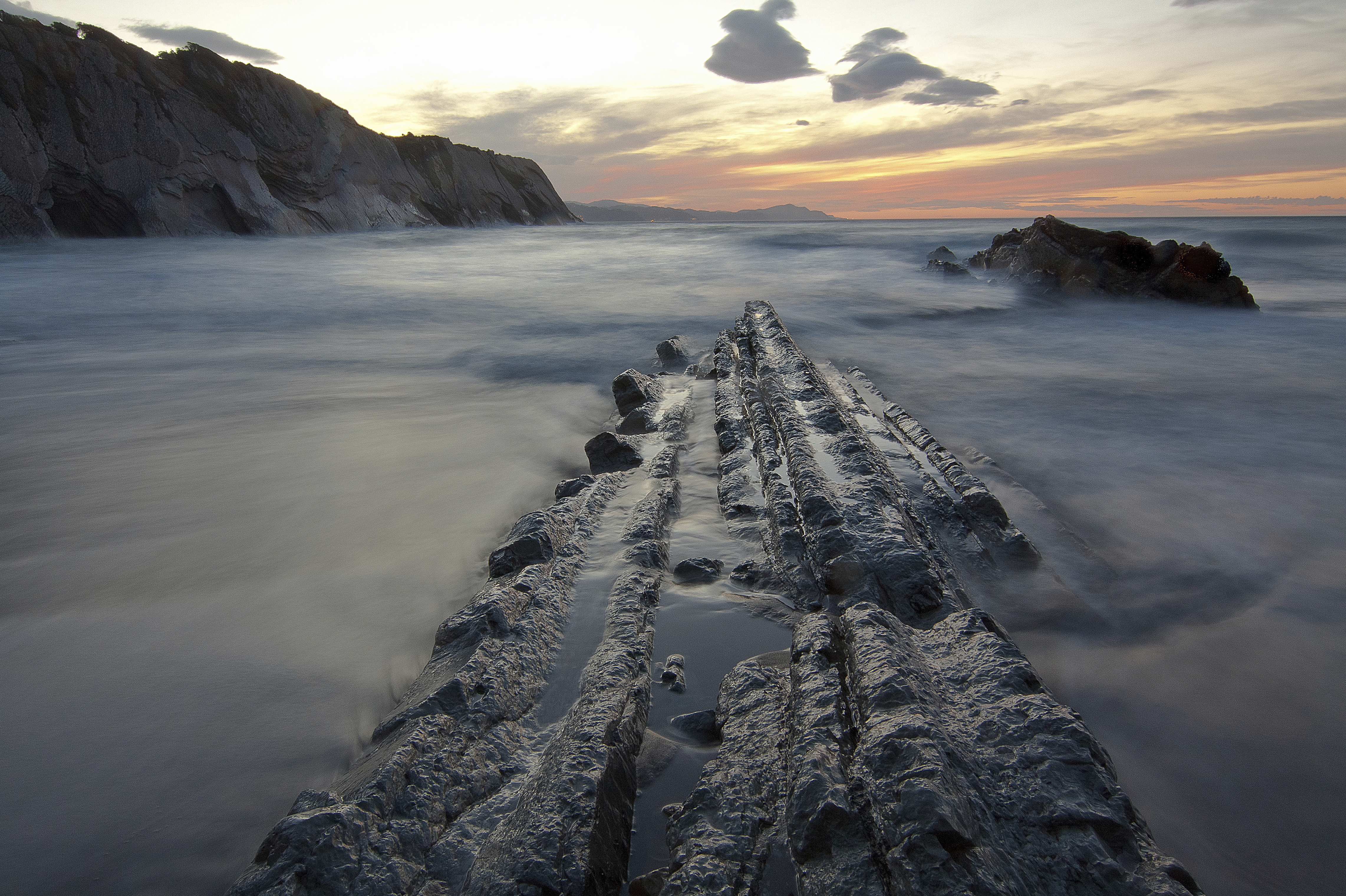 Download mobile wallpaper Rocks, Nature, Sea, Sunset, Landscape for free.