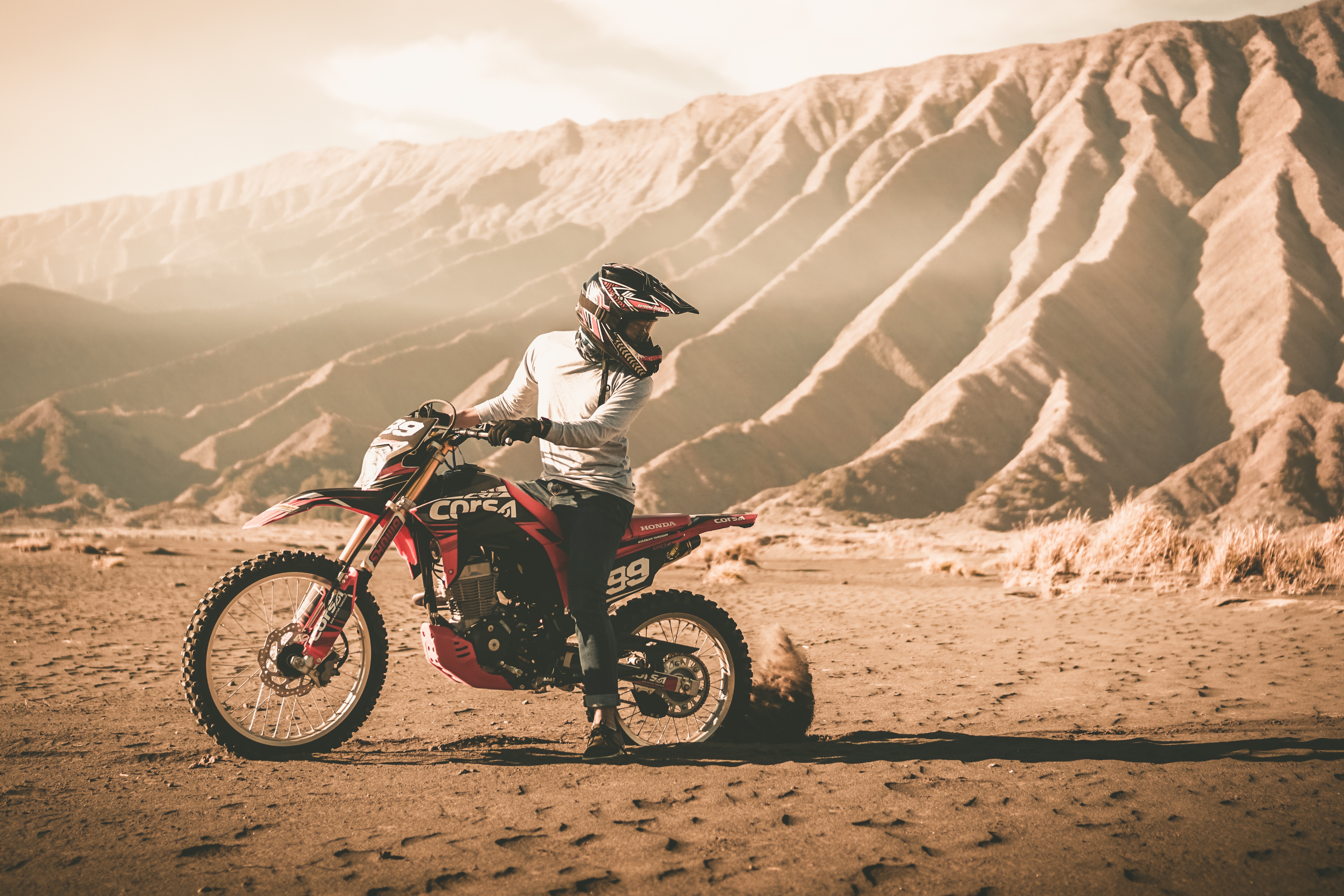 motorcyclist, cross, mountains, sand, motorcycles, helmet, motorcycle, off road, impassability phone wallpaper