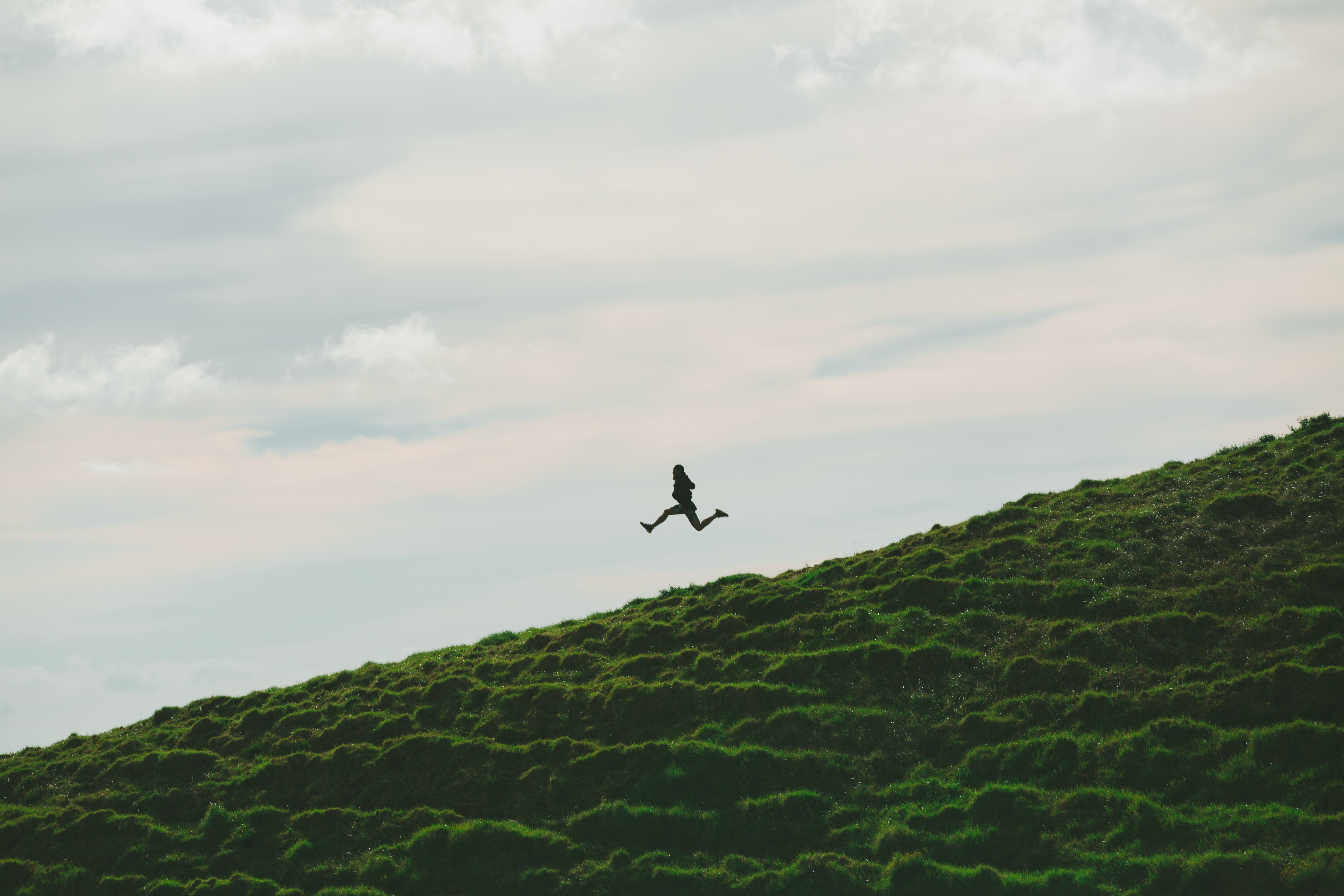 Download mobile wallpaper Bounce, Jump, Grass, Nature, Sky, Person, Human, Minimalism for free.