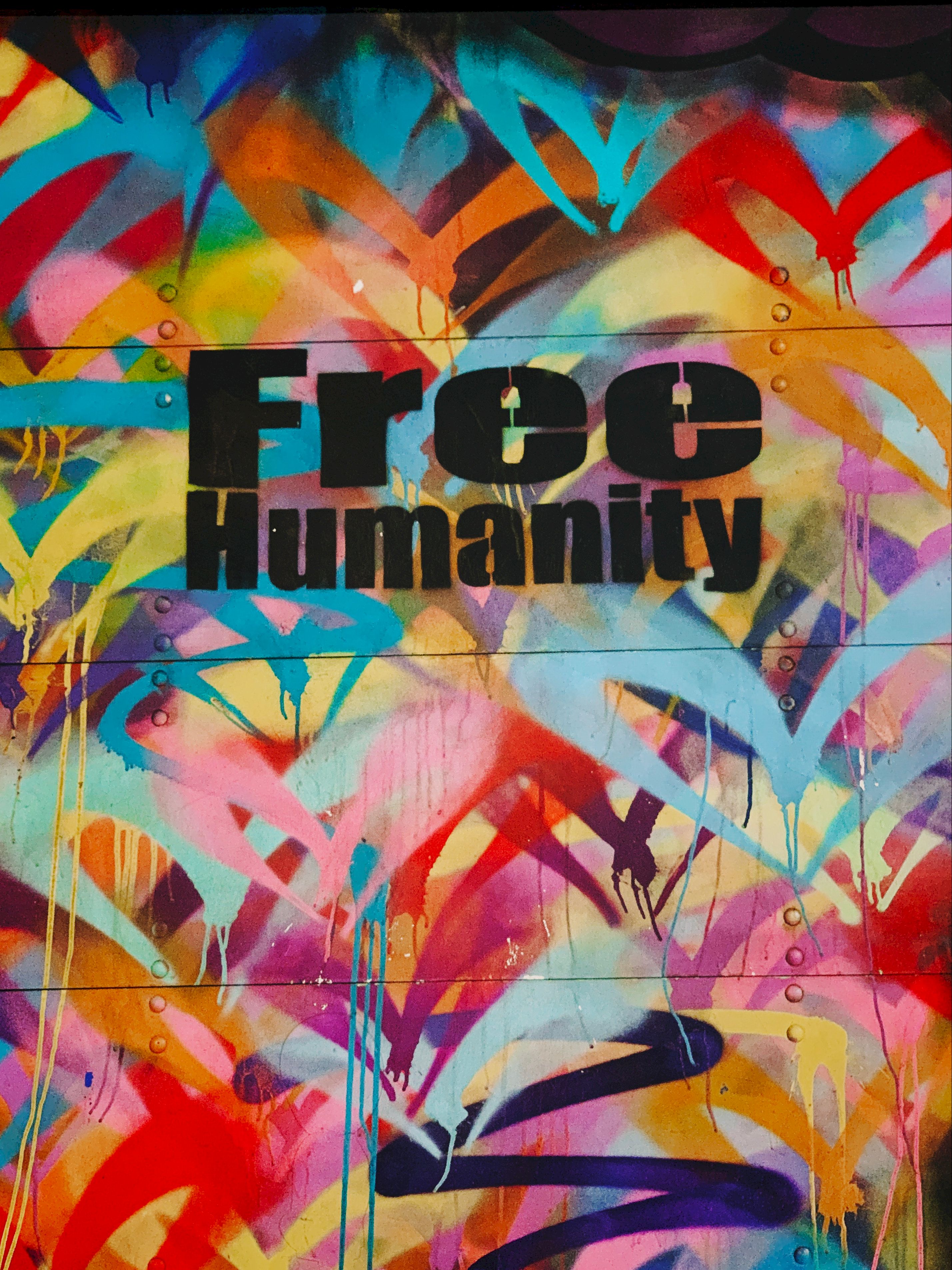 Download mobile wallpaper Graffiti, Mankind, Humanity, Multicolored, Wall, Motley, Words, Freedom for free.