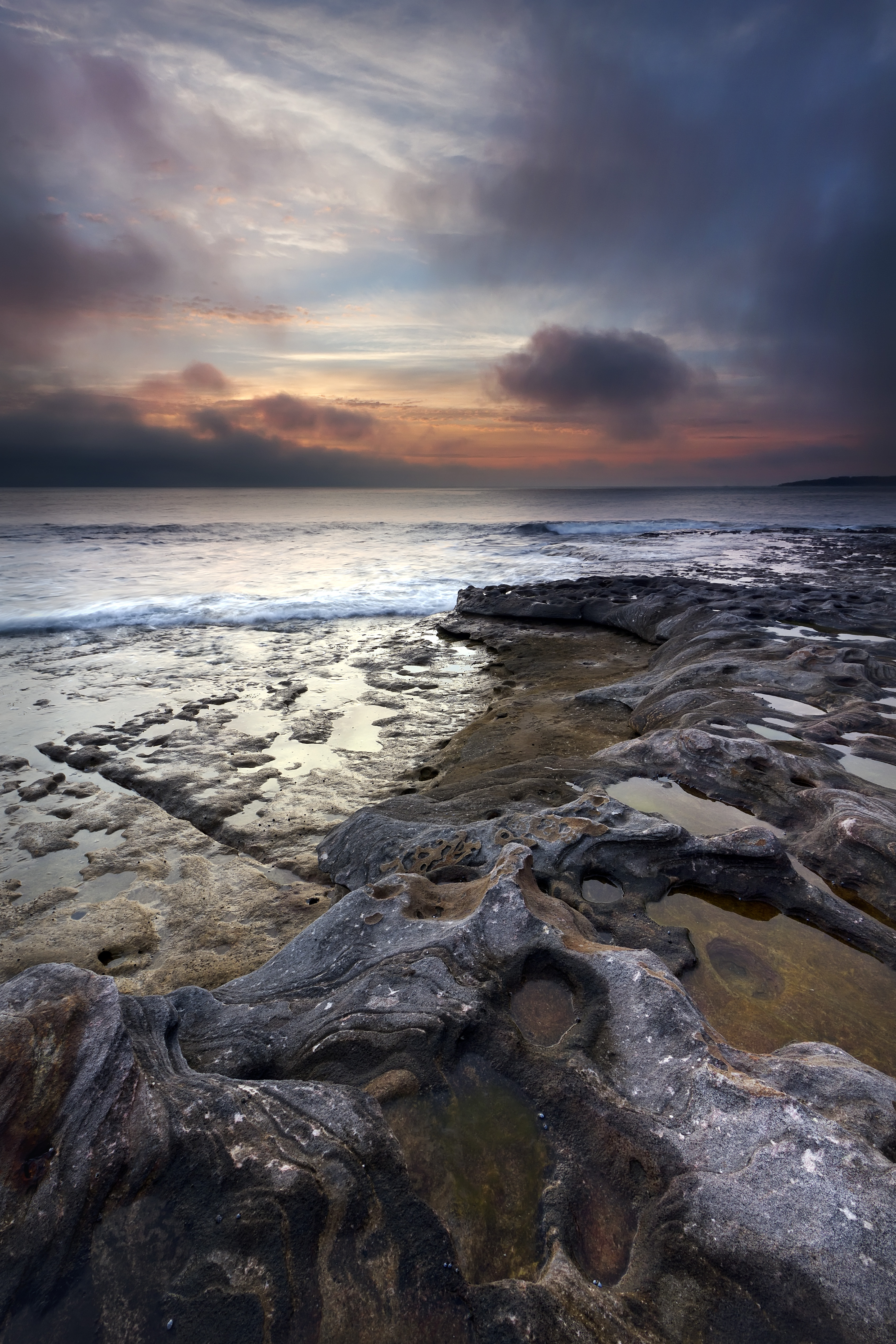Download mobile wallpaper Stones, Coast, Sky, Waves, Nature, Sea for free.