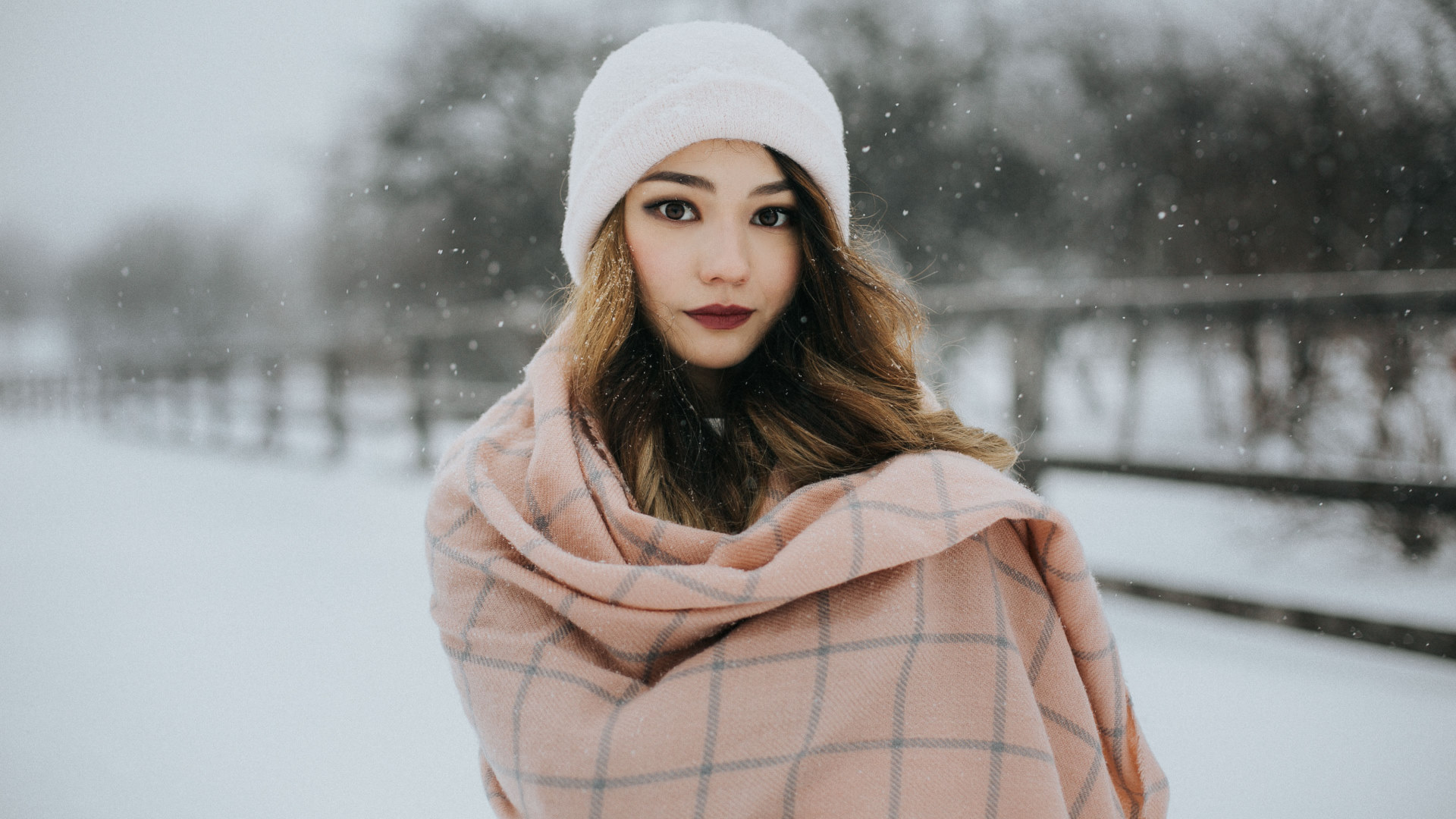 Download mobile wallpaper Winter, Snow, Hat, Brunette, Model, Women, Snowfall, Brown Eyes, Lipstick, Depth Of Field for free.