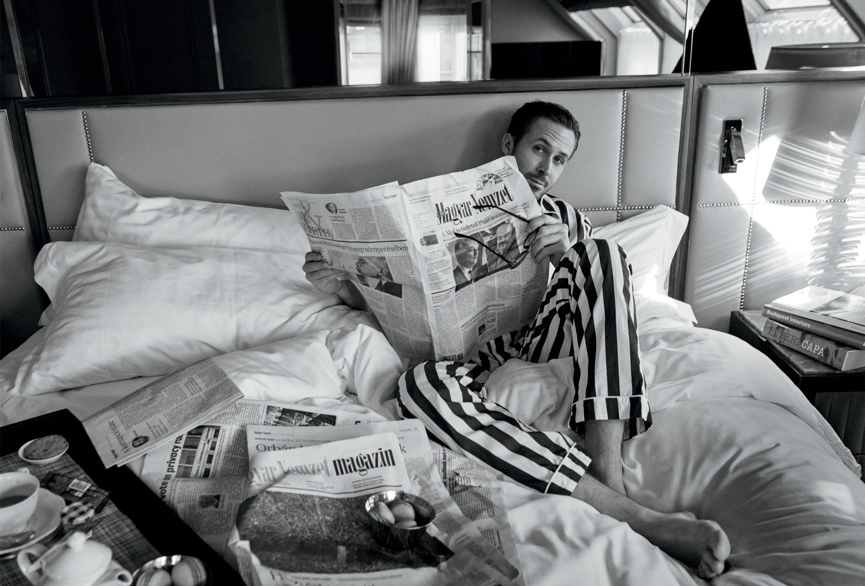 ryan gosling, celebrity, actor, bed, black & white, canadian, feet, newspaper, pajamas cellphone