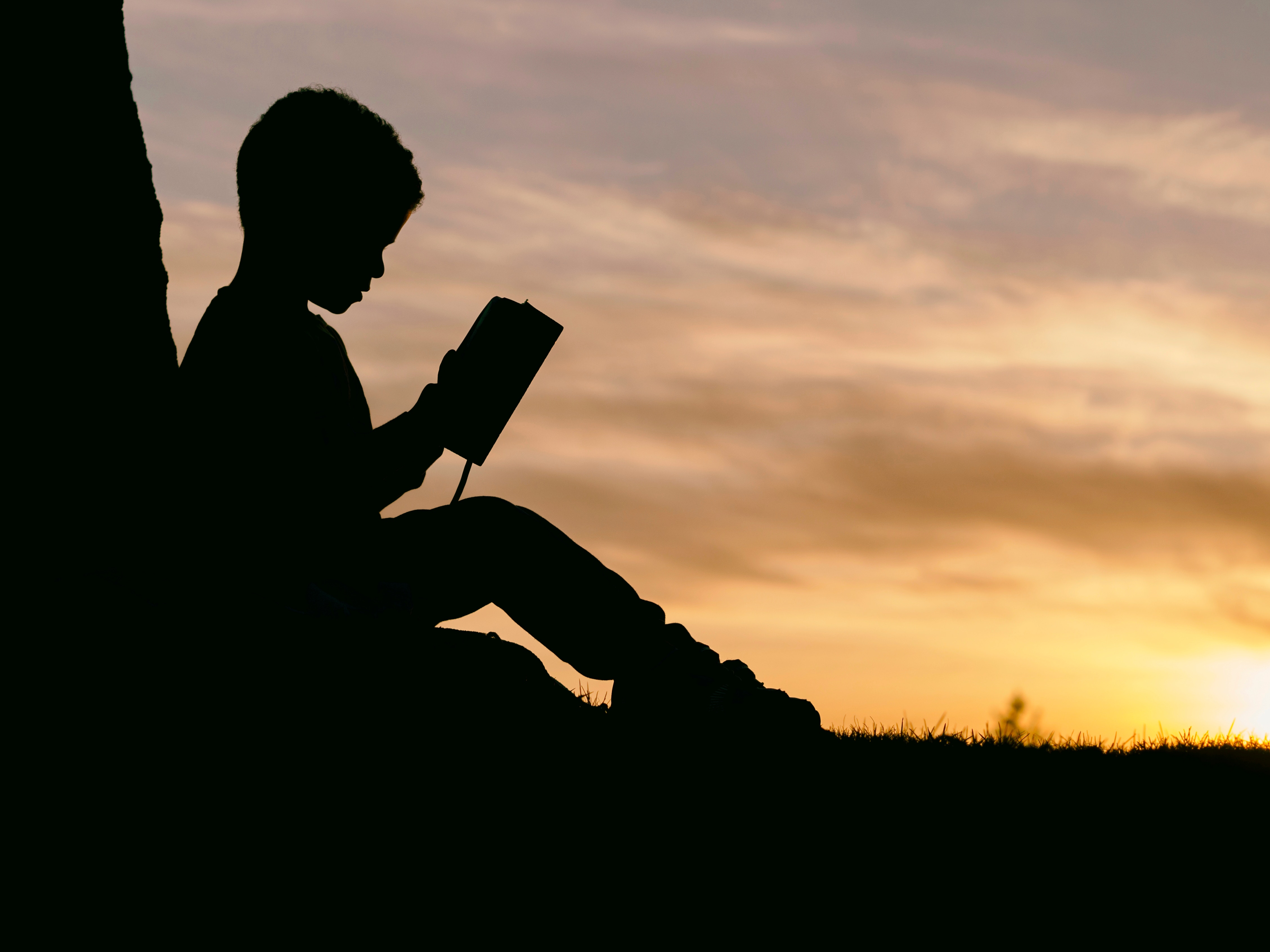 Download mobile wallpaper Child, Sunset, Book, Silhouette, Dark for free.