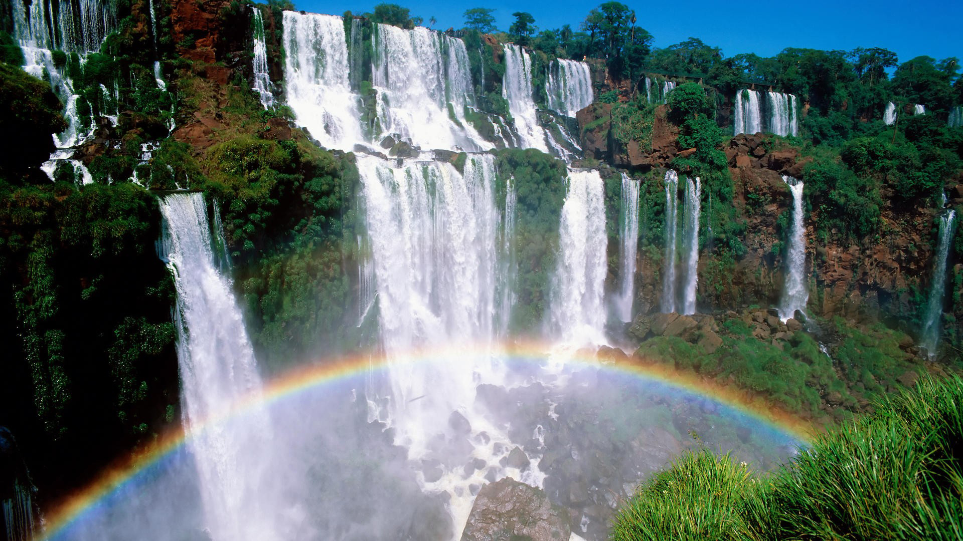 Download mobile wallpaper Rainbow, Waterfall, Earth, Iguazu Falls for free.