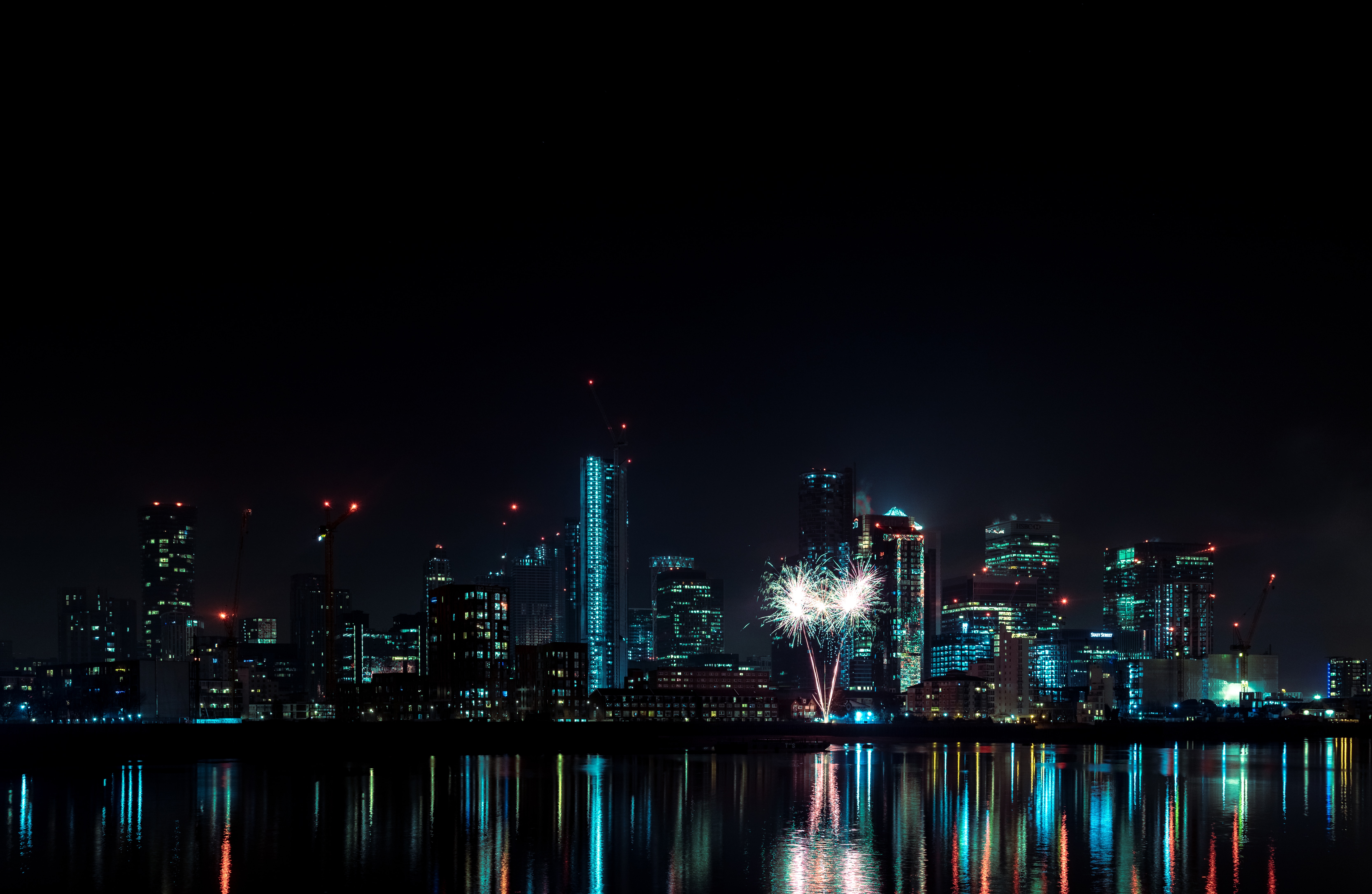 Download mobile wallpaper Fireworks, Cities, Building, Reflection, Night City, Water, Firework for free.