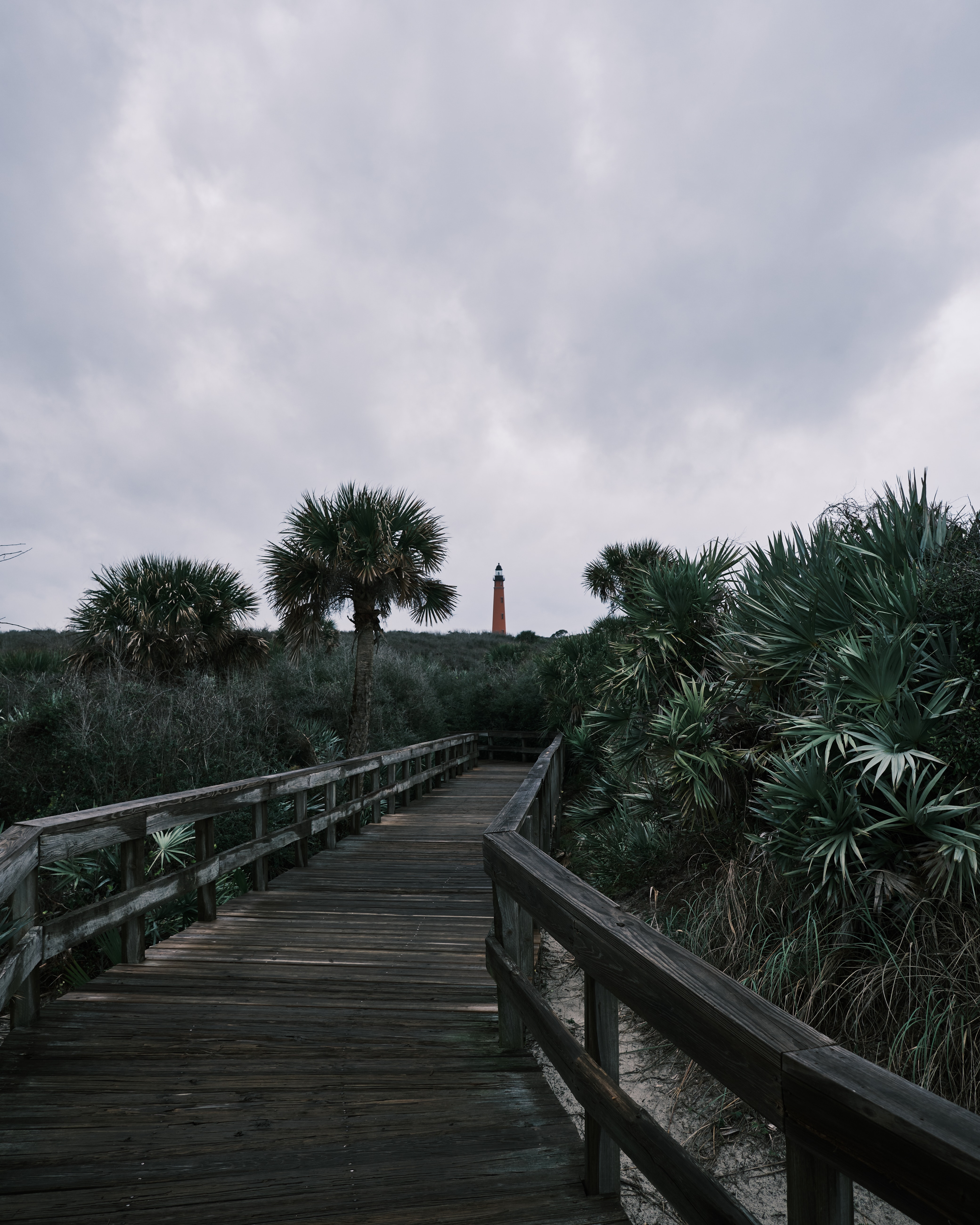 Download mobile wallpaper Bush, Wood, Trees, Bridge, Lighthouse, Wooden, Nature for free.