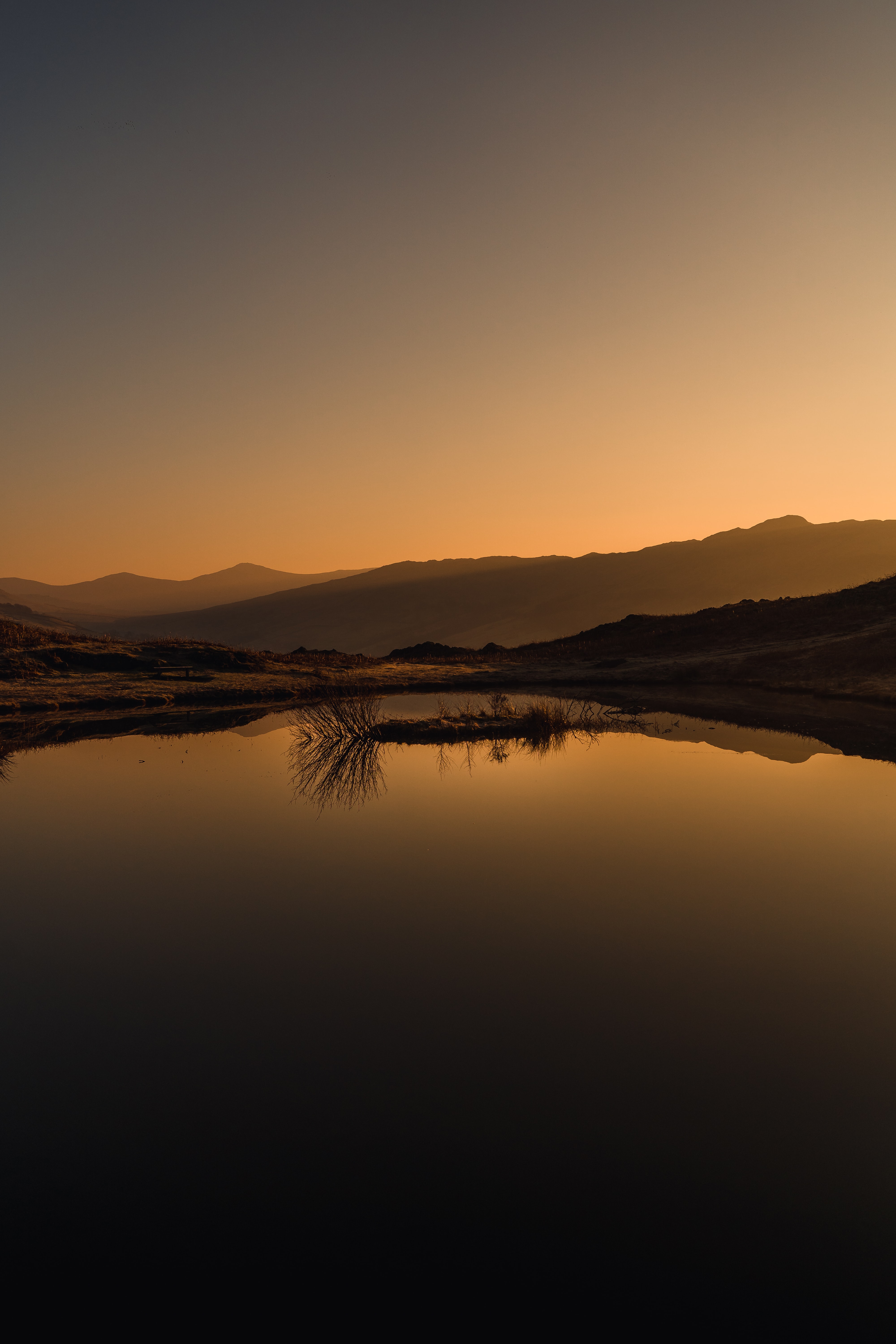 Download mobile wallpaper Landscape, Reflection, Sunset, Lake, Mountains, Nature for free.
