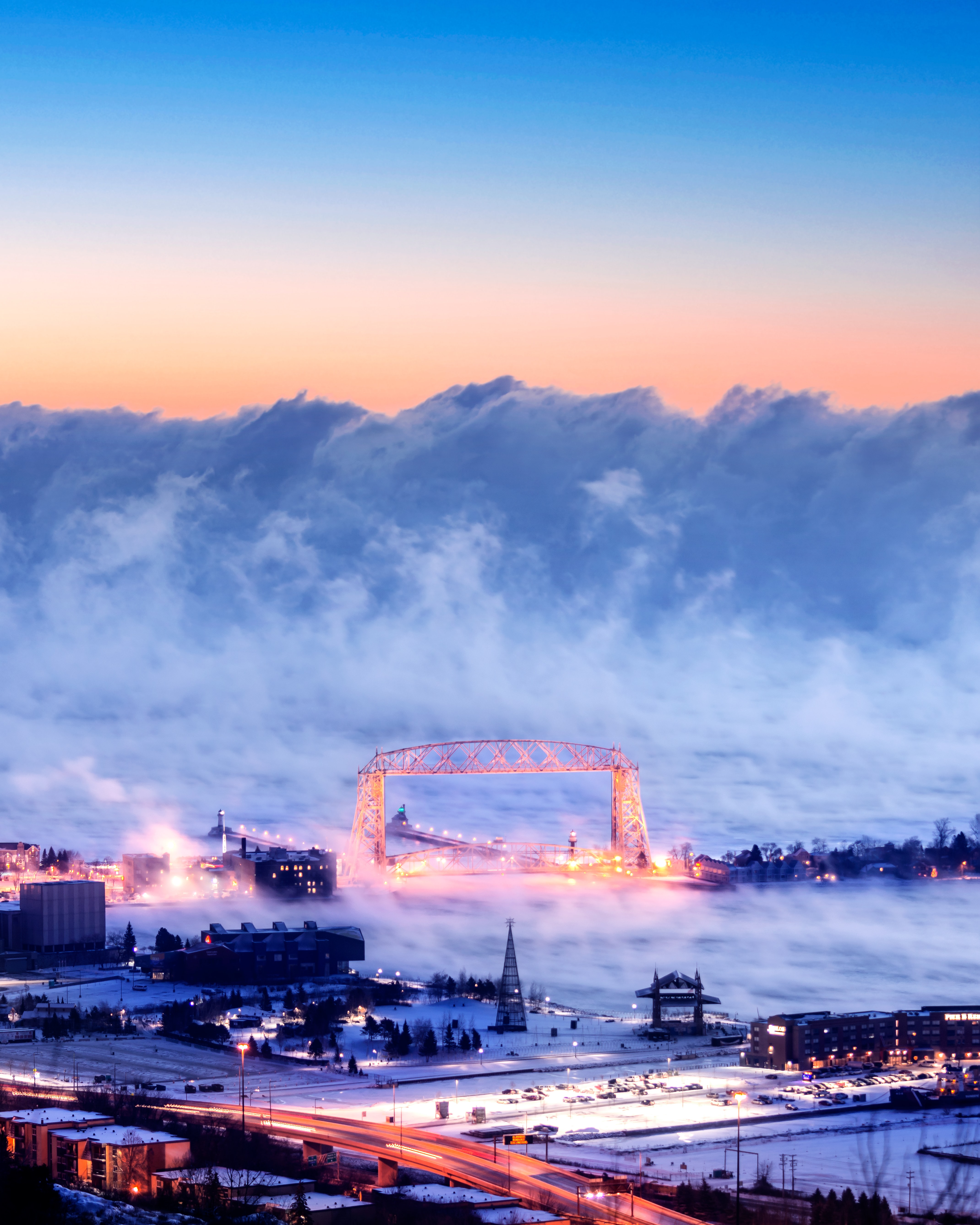 Free download wallpaper Snow, Building, View From Above, Bridge, Cities, Road, City, Storm on your PC desktop