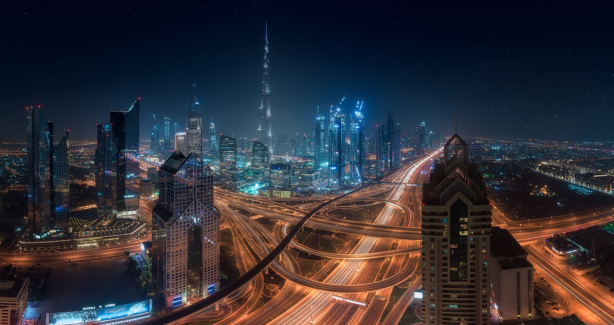 Download mobile wallpaper Cities, Night, City, Skyscraper, Building, Light, Dubai, United Arab Emirates, Highway, Man Made for free.