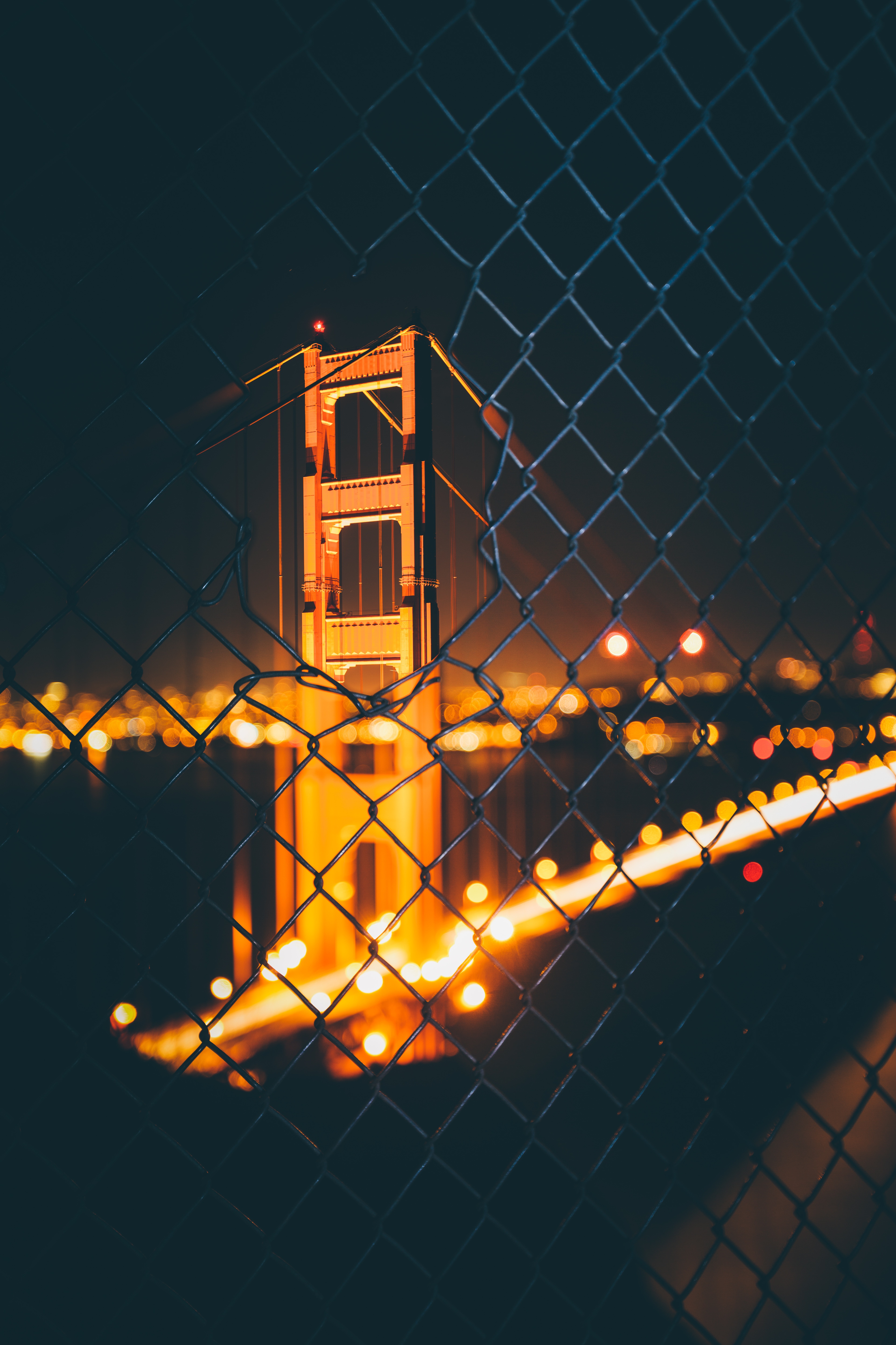 Download mobile wallpaper Cities, Fence, Bridge, Boquet, Smooth, Glare, Grid, Night, Bokeh, Blur for free.