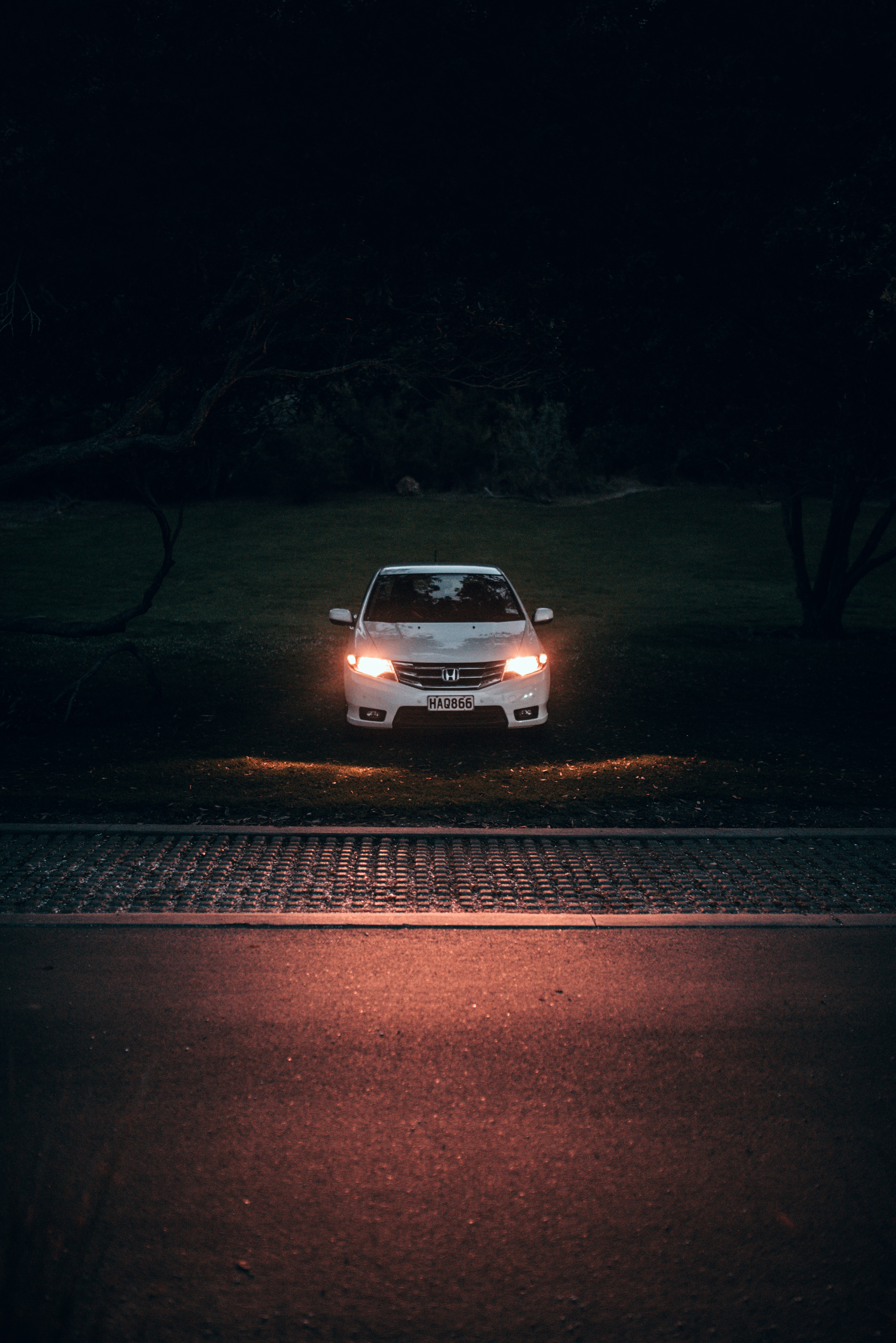 Download mobile wallpaper Lights, Car, Machine, Shine, Headlights, Front View, Cars, Light, Dark for free.