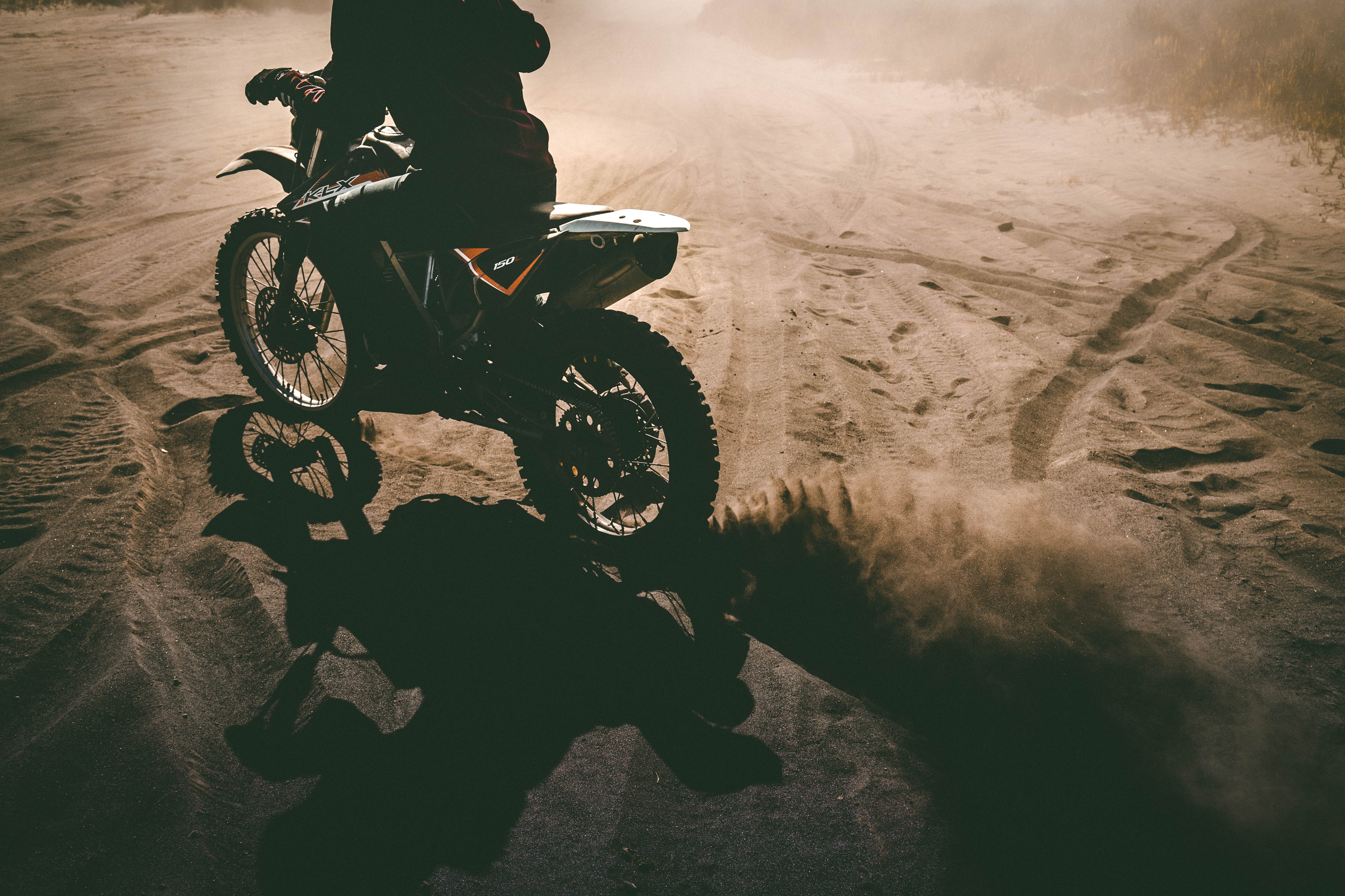 Download mobile wallpaper Motorcyclist, Sand, Motorcycle, Motorcycles for free.