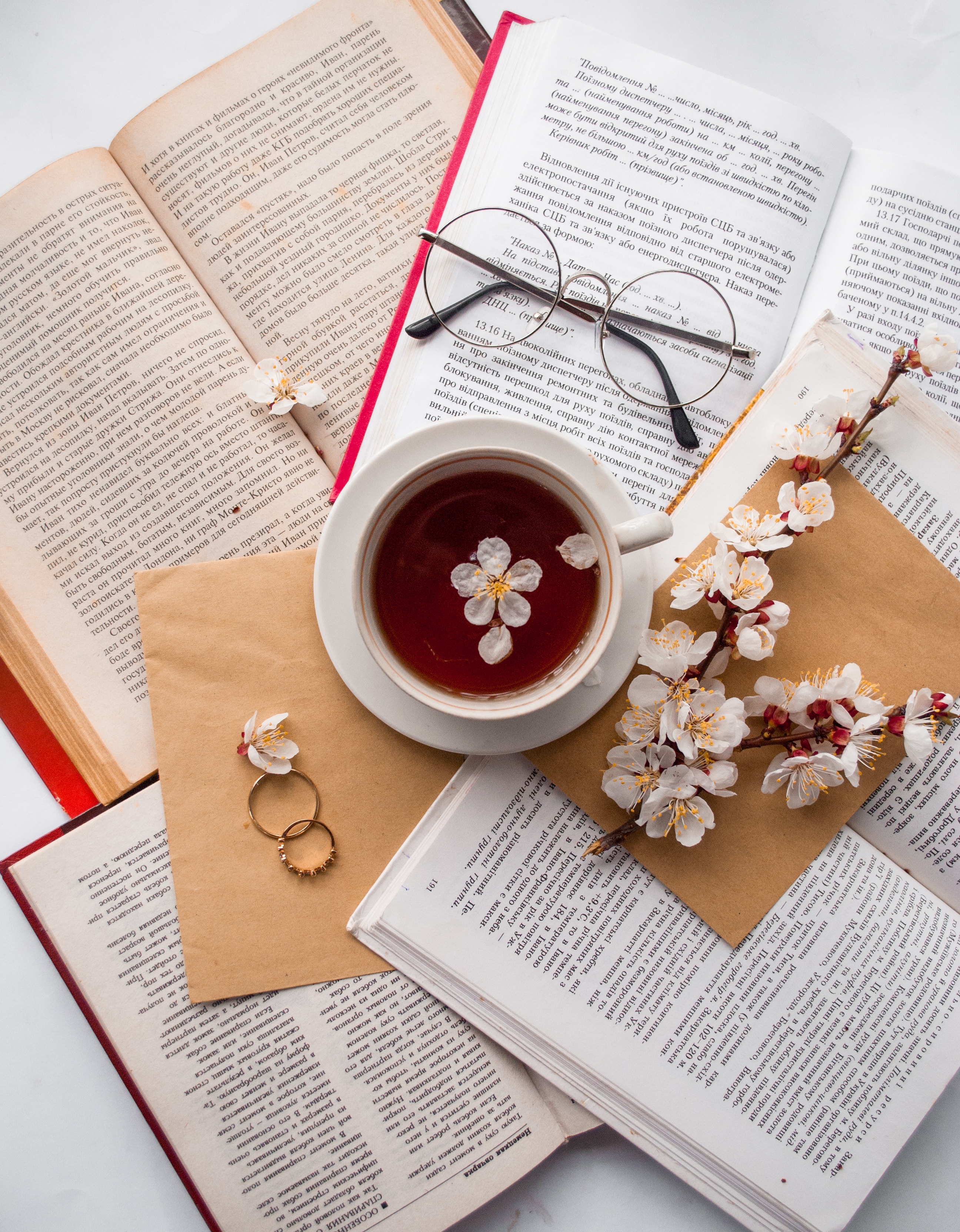 books, cup, flowers, rings, miscellanea, miscellaneous, glasses, spectacles