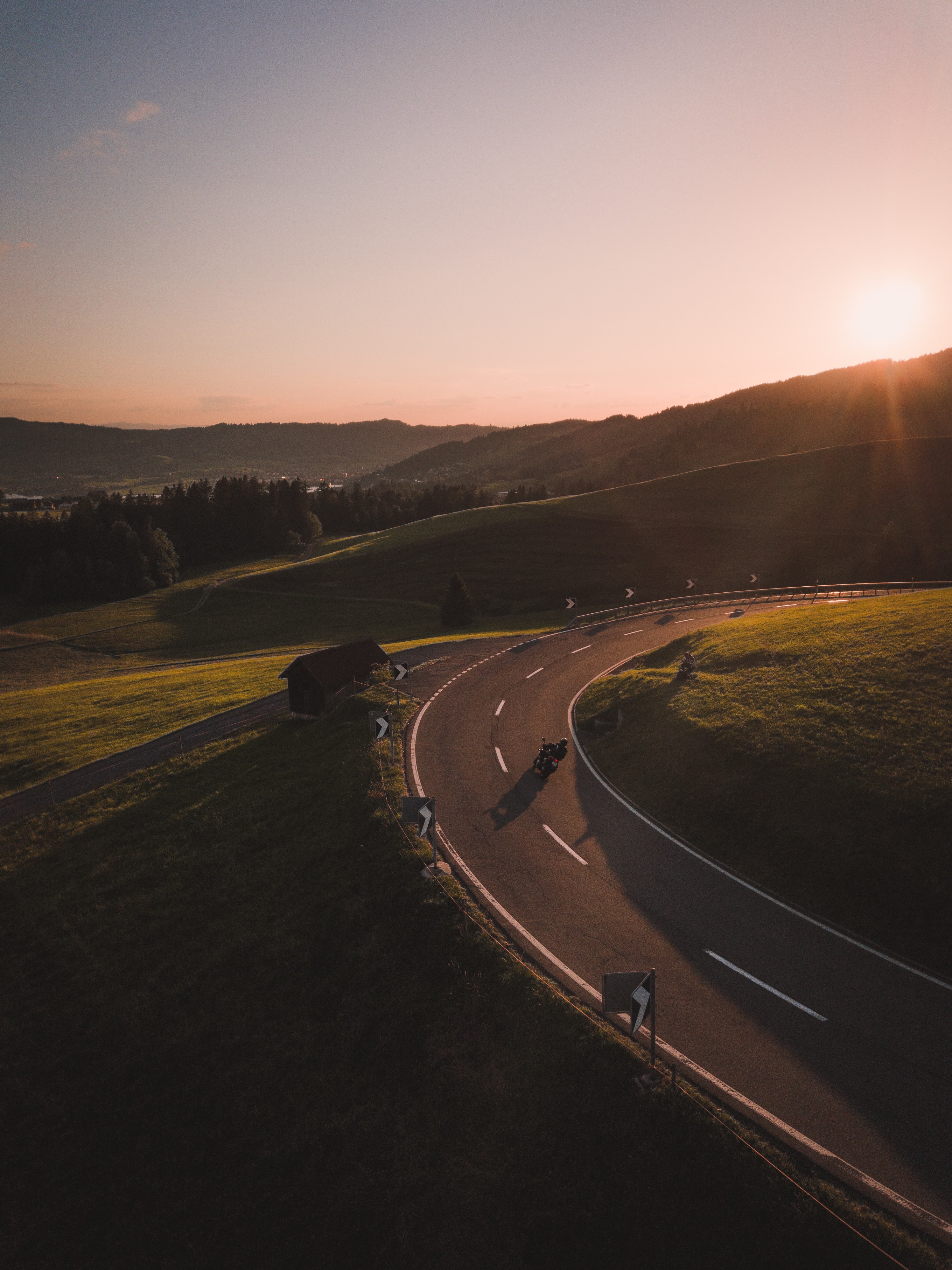 Download mobile wallpaper Beams, Rays, Hill, Road, Nature, Motorcycle, Motorcyclist for free.