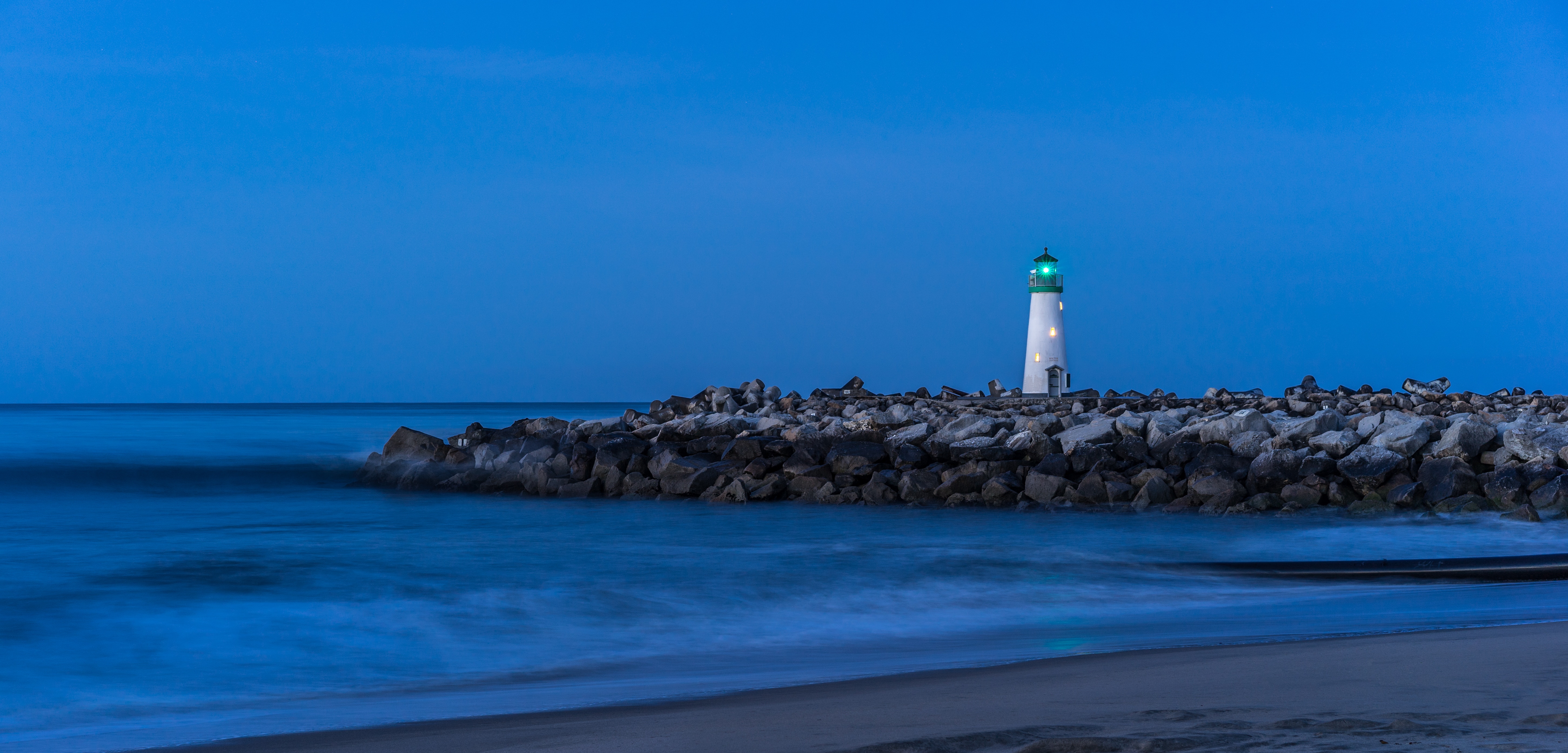 Free download wallpaper Sky, Shore, Bank, Lighthouse, Nature, Stones, Sea on your PC desktop
