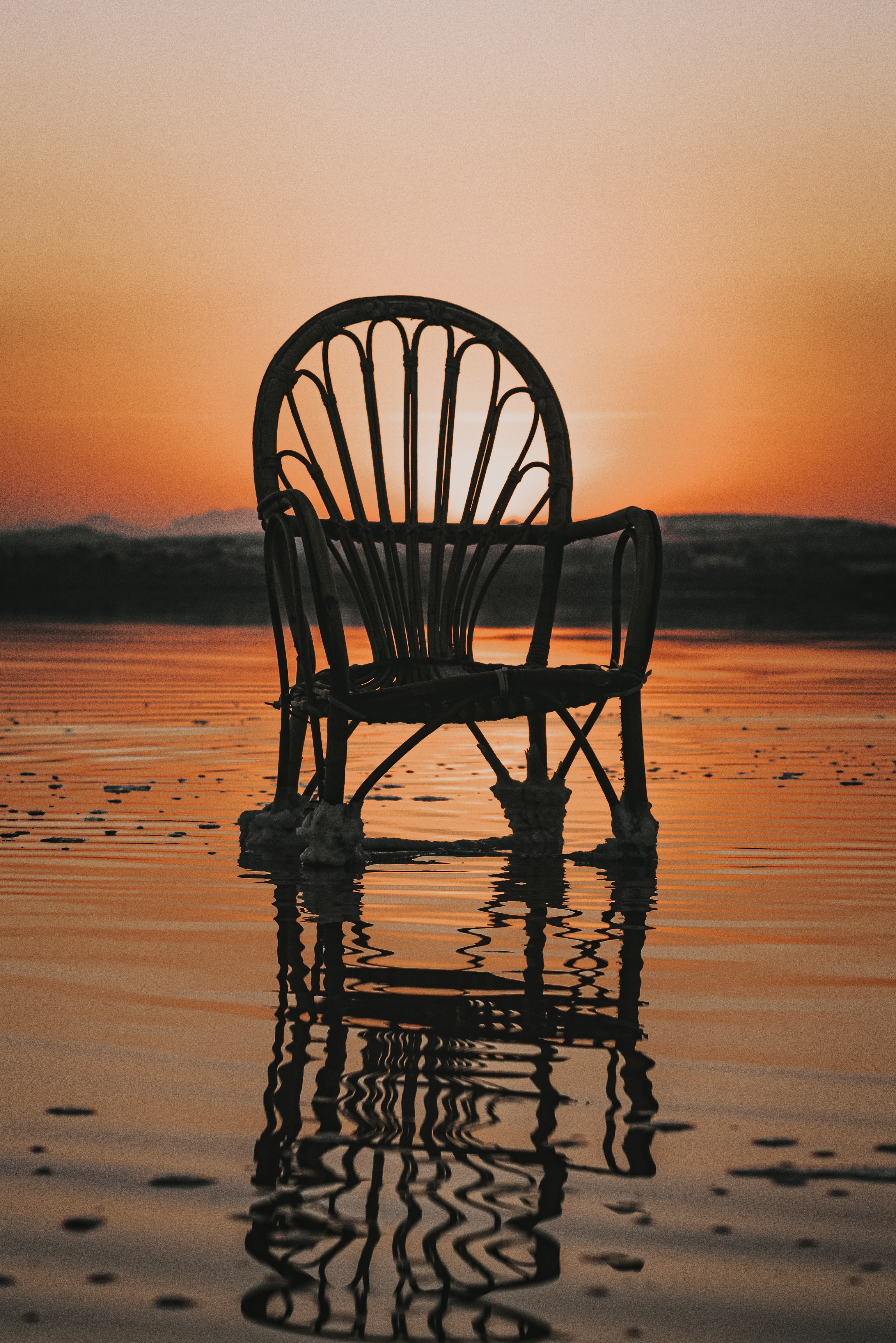 Download mobile wallpaper Reflection, Miscellaneous, Sea, Chair, Sunset, Water, Miscellanea for free.