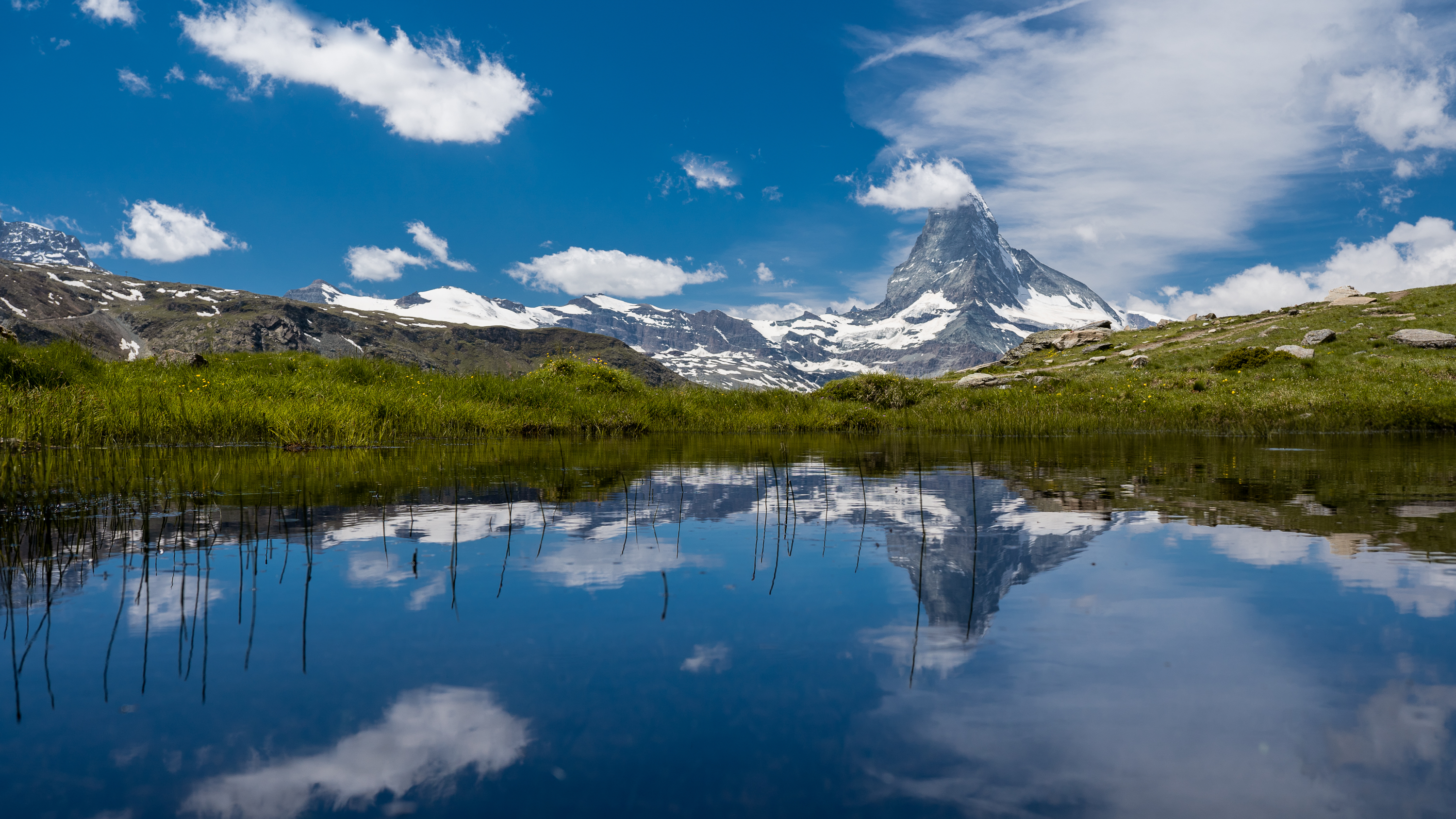 Download mobile wallpaper Grass, Mountains, Mountain, Earth, Switzerland, Matterhorn for free.