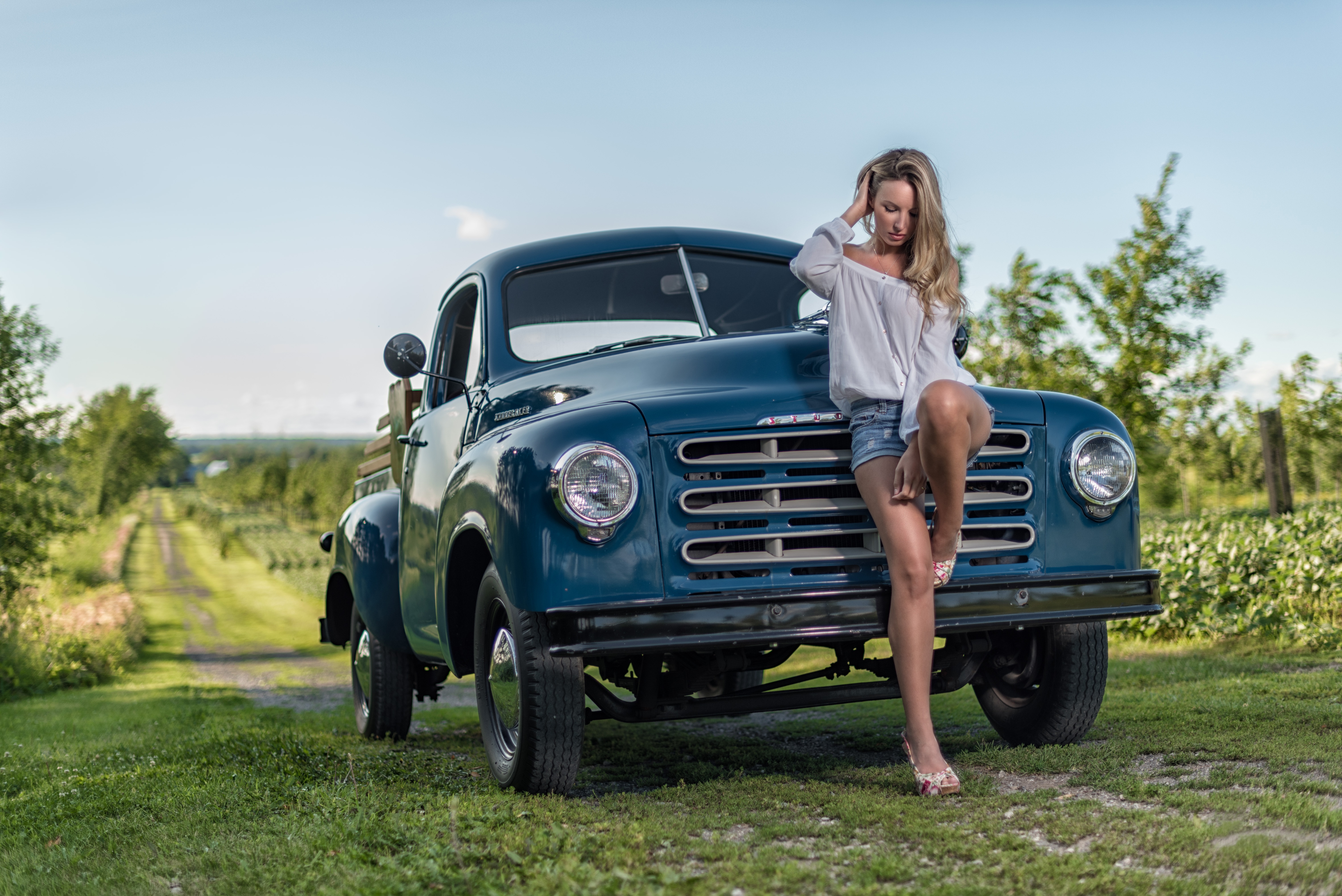 1920x1080 Background depth of field, studebaker, girls & cars, women, blonde, car, model, mood, shorts, vehicle