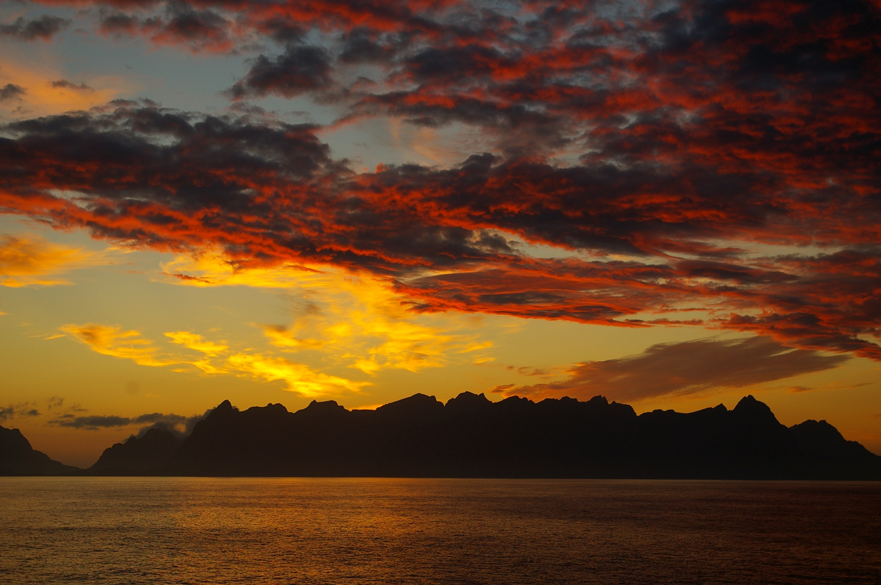 Download mobile wallpaper Clouds, Lofoten Islands, Mountains, Nature, Horizon, Sunset, Norway, Island for free.