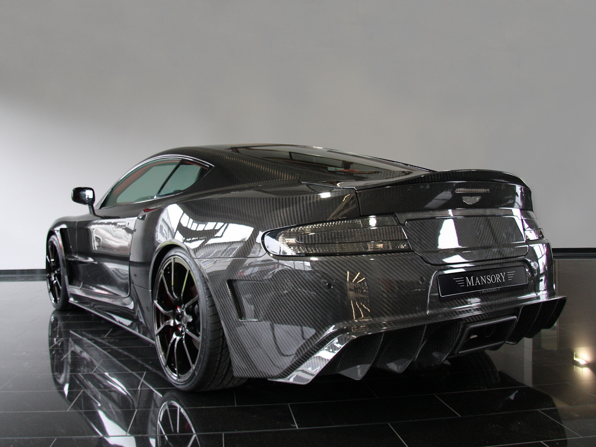 black, cars, aston martin, carbon, reflection, back view, rear view, style, dbs, 2009, mansory High Definition image