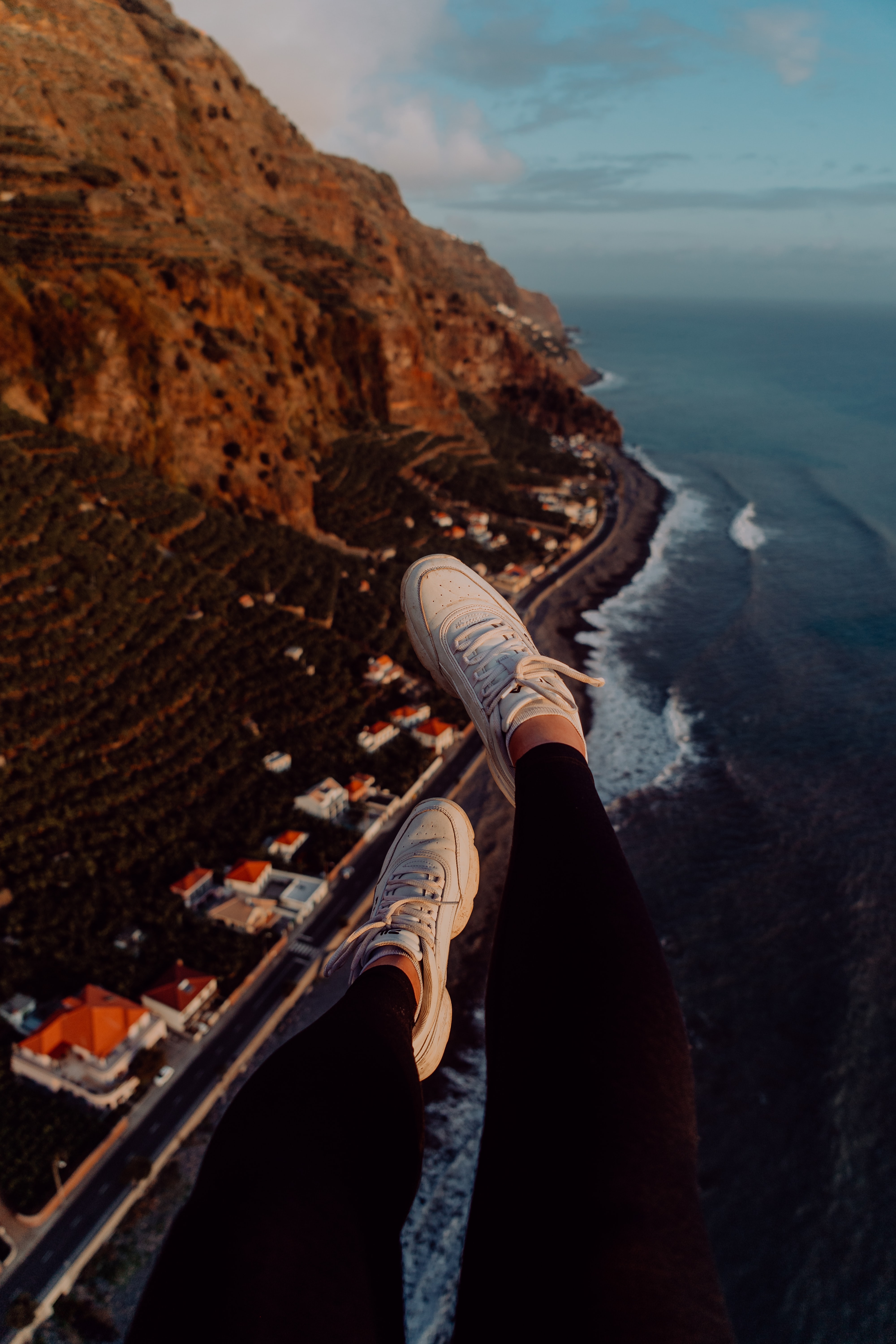 Free download wallpaper Mountains, City, View From Above, Coast, Miscellanea, Miscellaneous, Legs, Sneakers on your PC desktop
