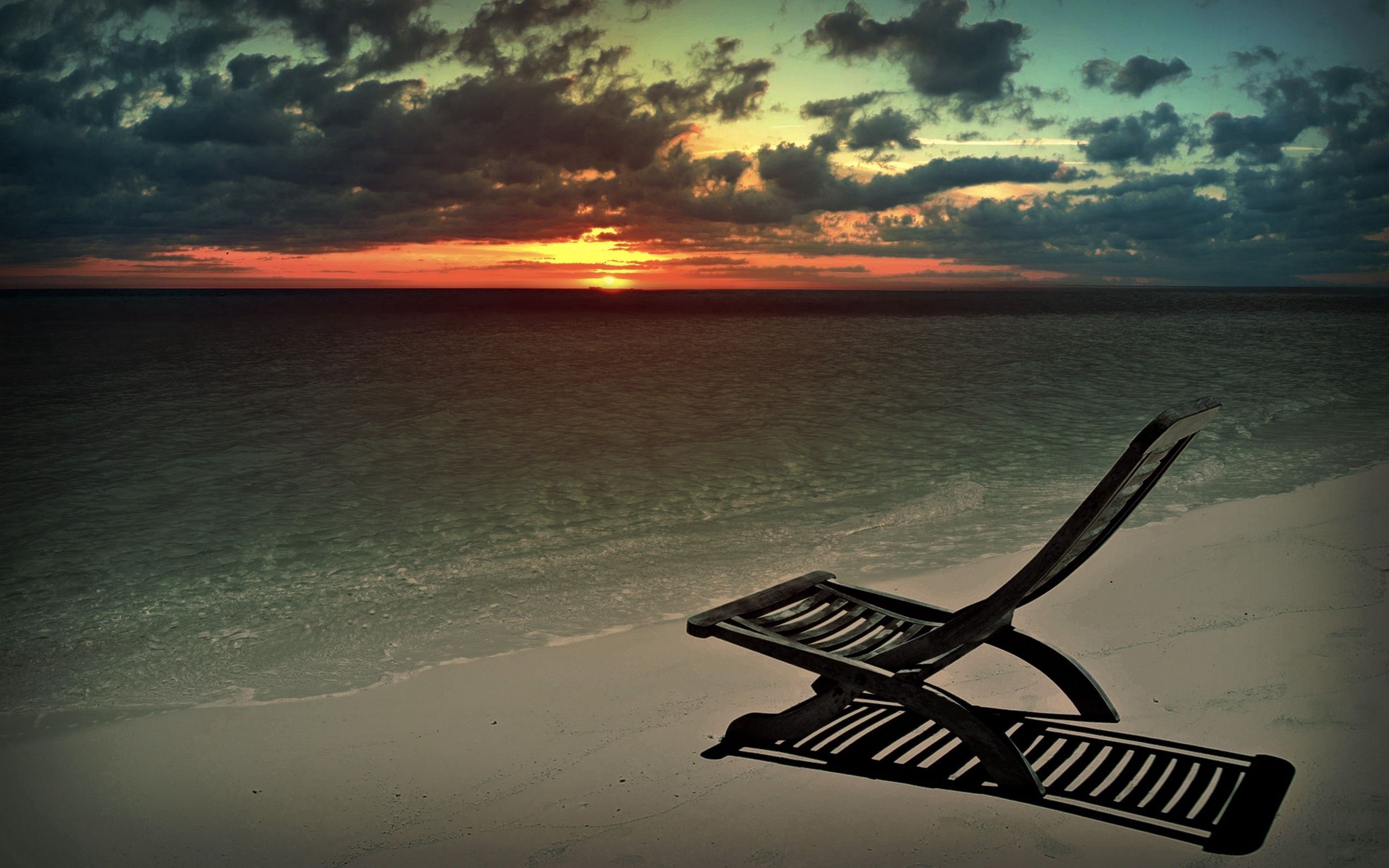 Download mobile wallpaper Sky, Armchair, Shadow, Sand, Sunset, Sun, Nature, Beach for free.