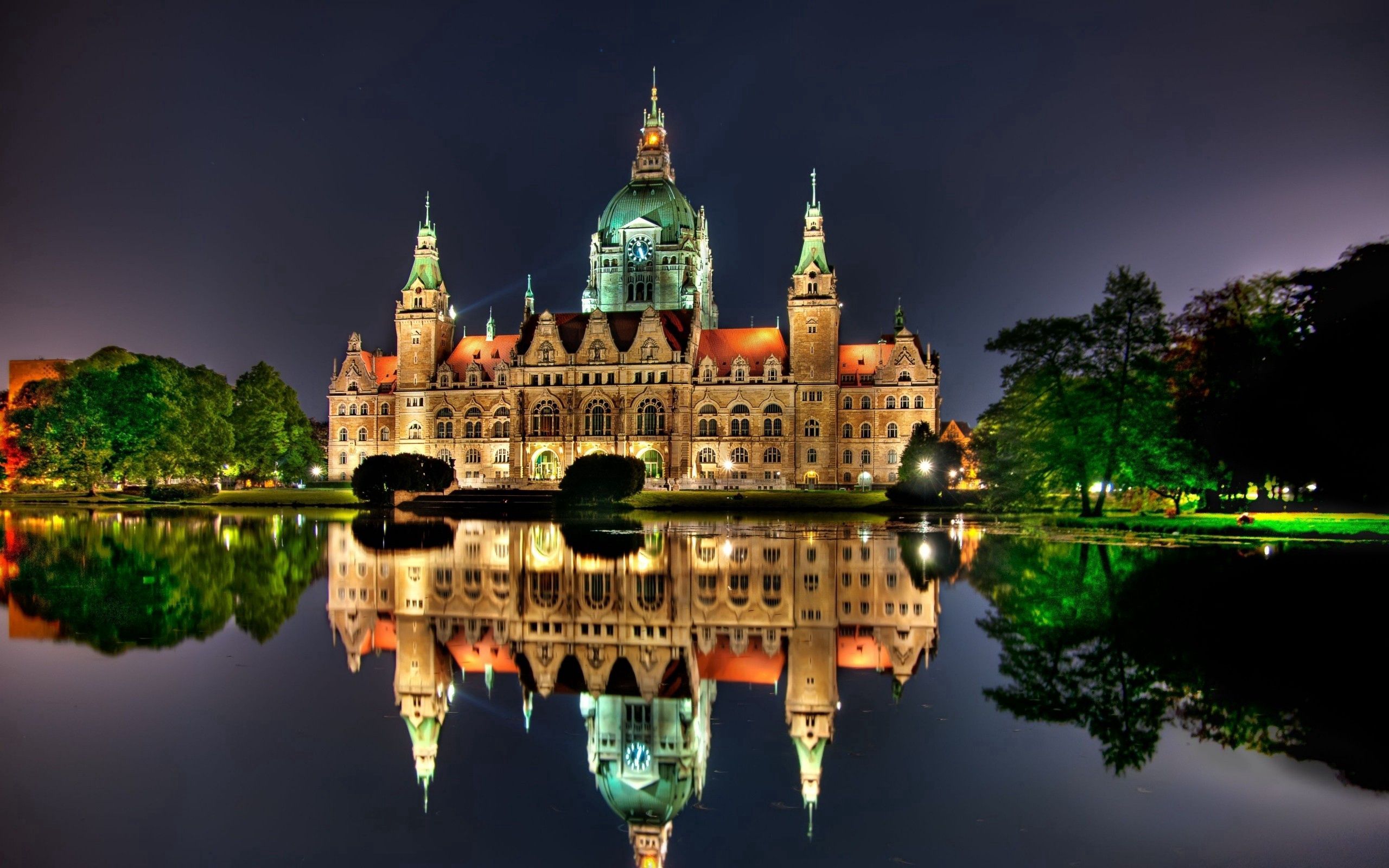 Download mobile wallpaper Germany, Hanover, Reflection, Cities, Building, Shine, Brilliance, Night for free.