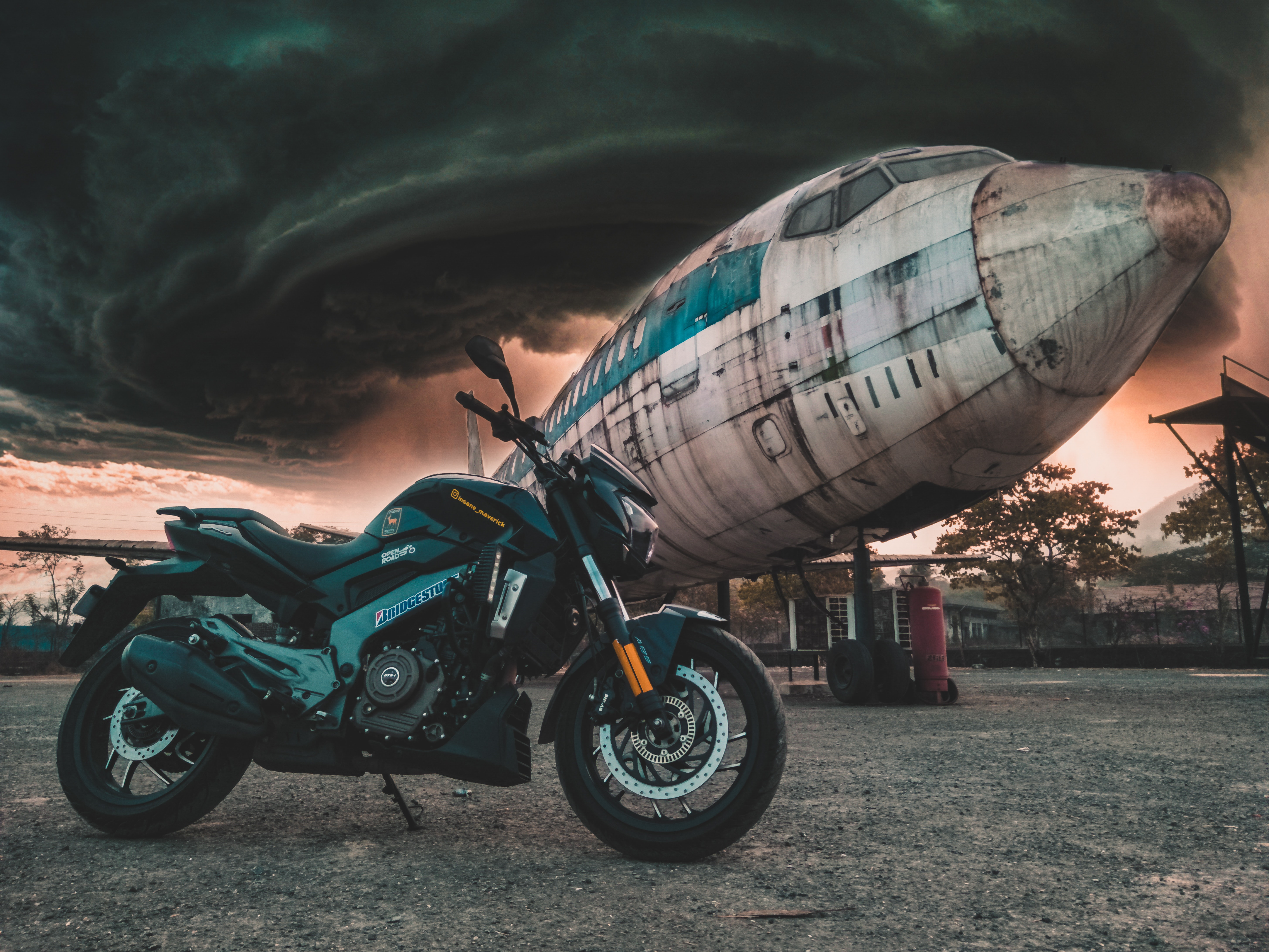 Download mobile wallpaper Motorcycles, Plane, Mainly Cloudy, Overcast, Clouds, Side View, Motorcycle, Airplane for free.