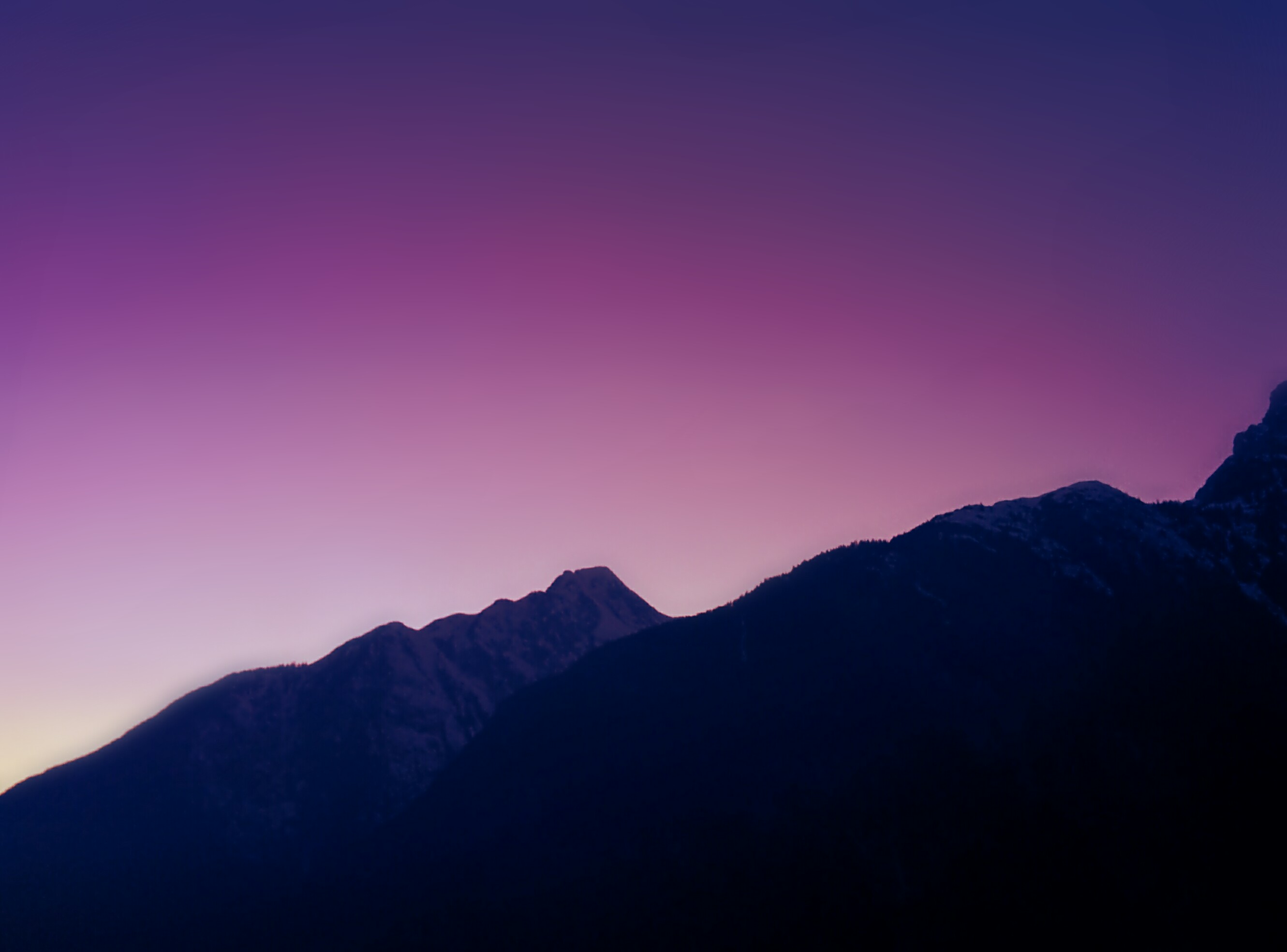 Download A Purple And Blue Background With A Mountain And Mountains