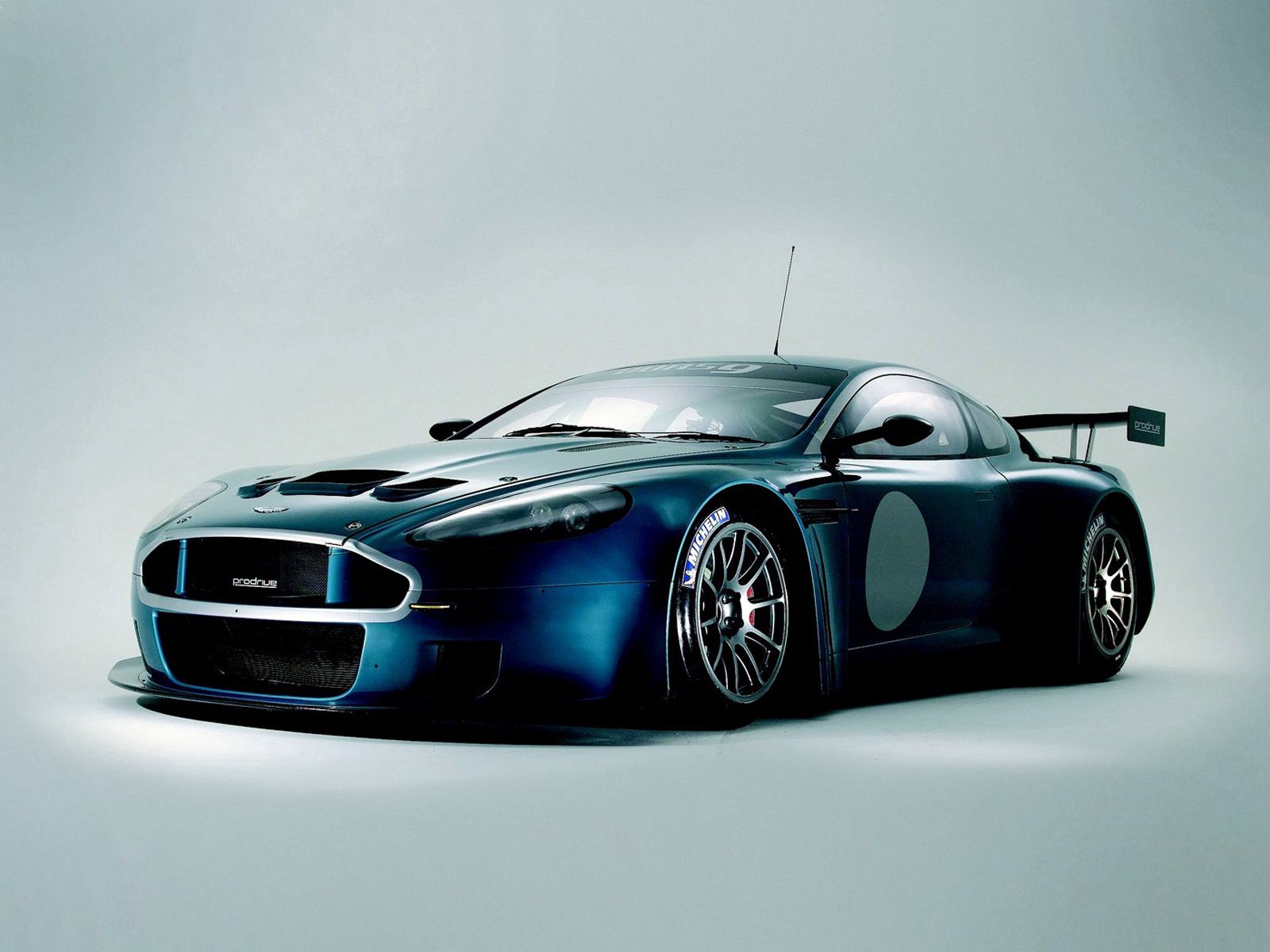 front view, sports, auto, aston martin, cars, blue, style, 2005, dbrs9 wallpaper for mobile