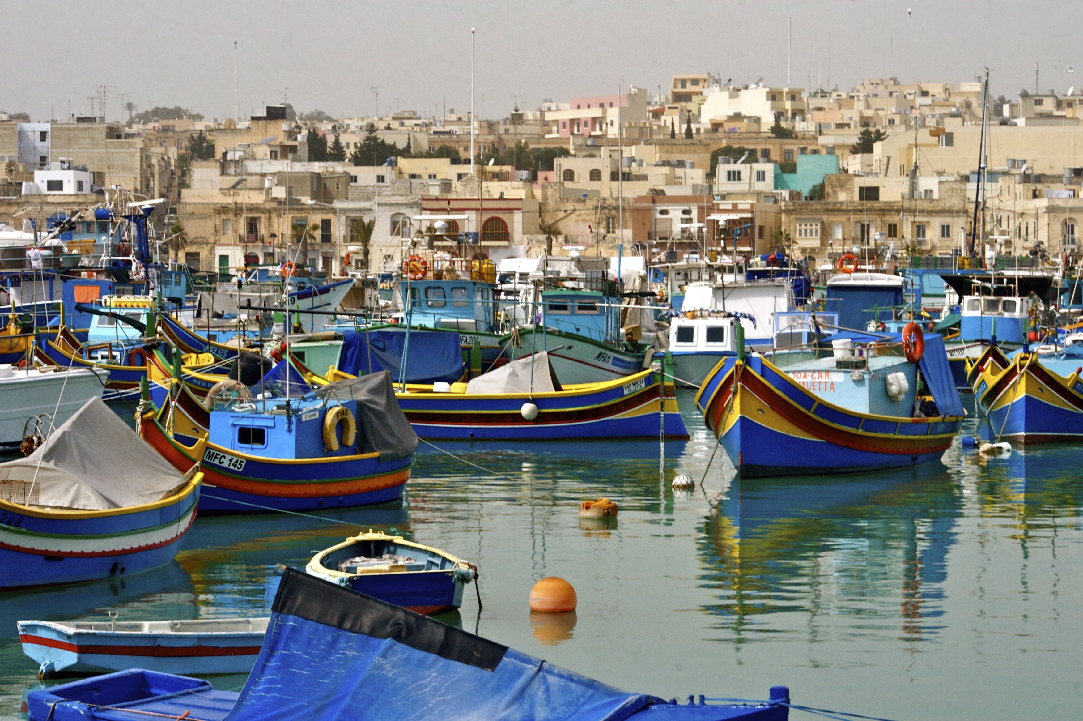 Марсашлокк. ФК Марсашлокк. Traditional Fisherman Village and Boats. Malta.