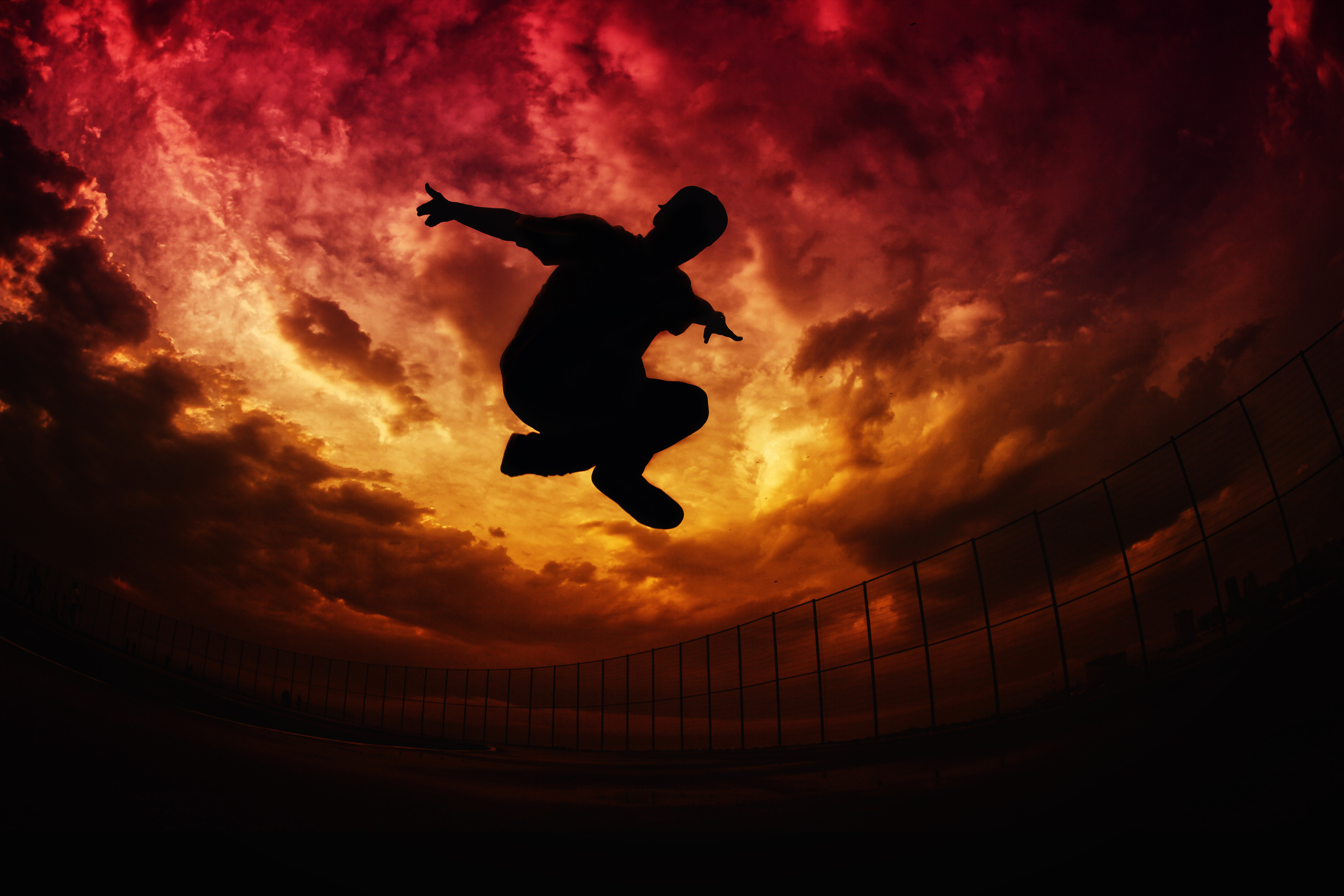 Download mobile wallpaper Bounce, Parkour, Fence, Clouds, Jump, Sky, Silhouette, Dark for free.