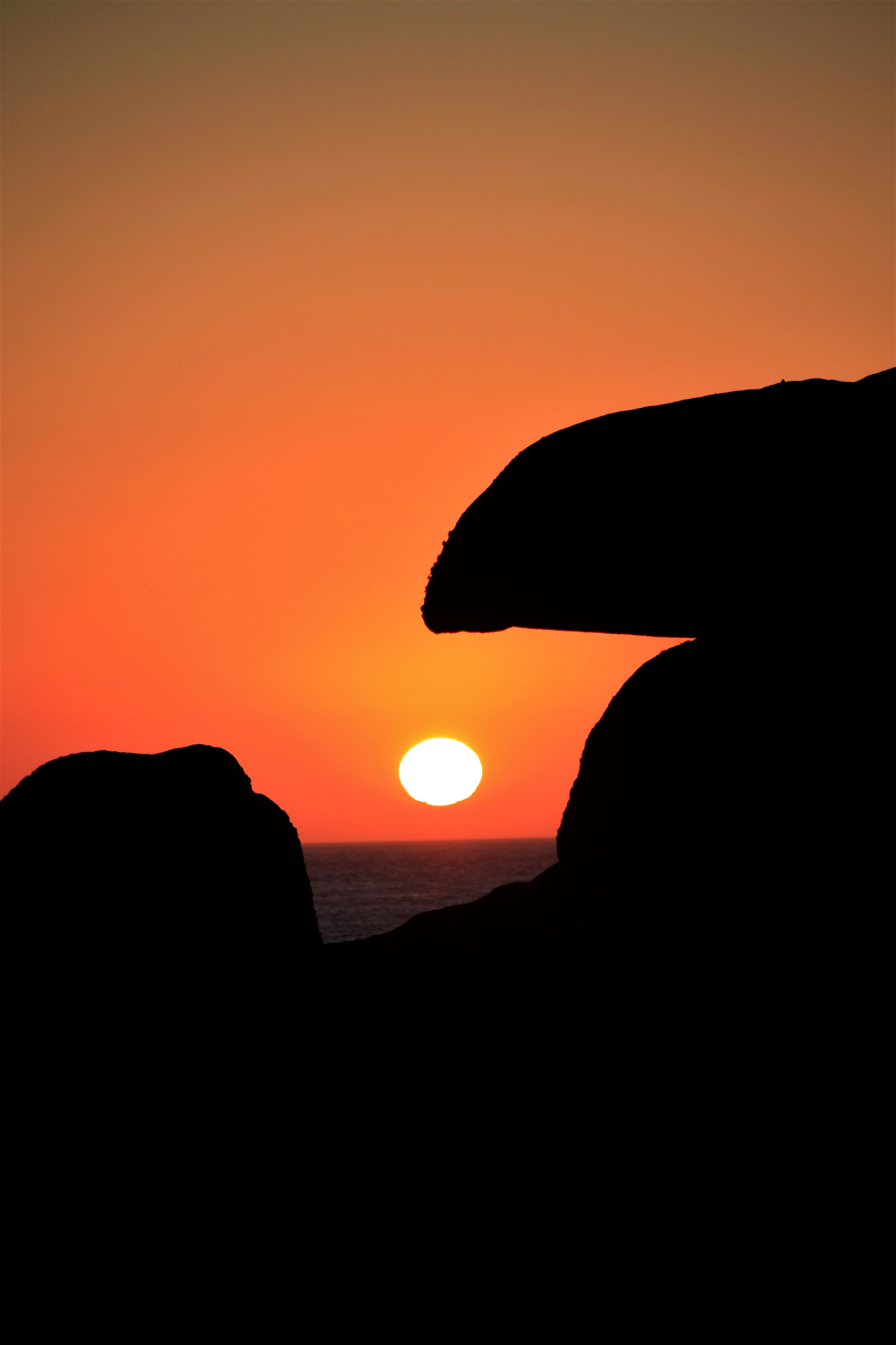 Download mobile wallpaper Rocks, Sunset, Sun, Dark for free.